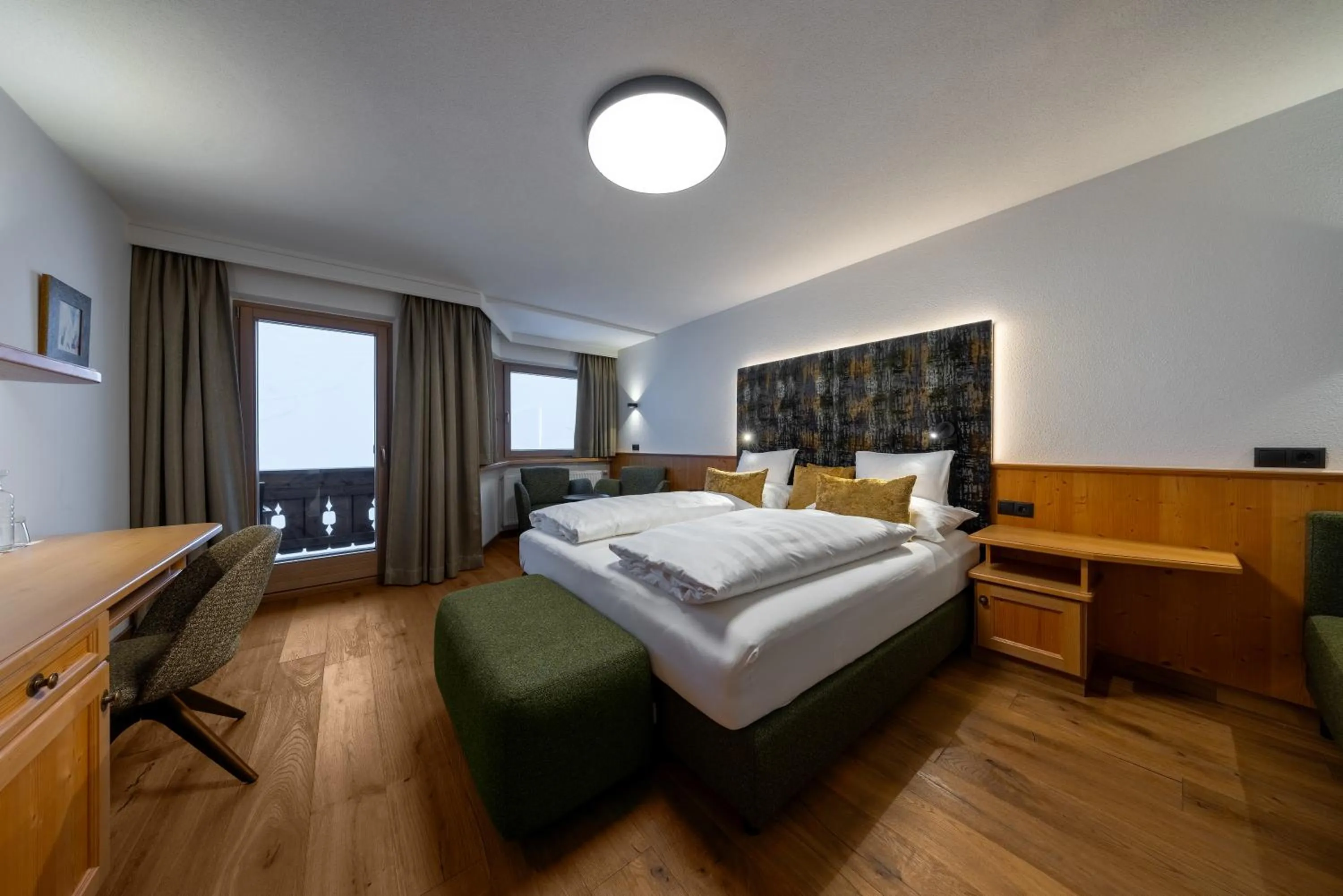 Photo of the whole room, Bed in Hotel Tirolerhof 4 Sterne Superior