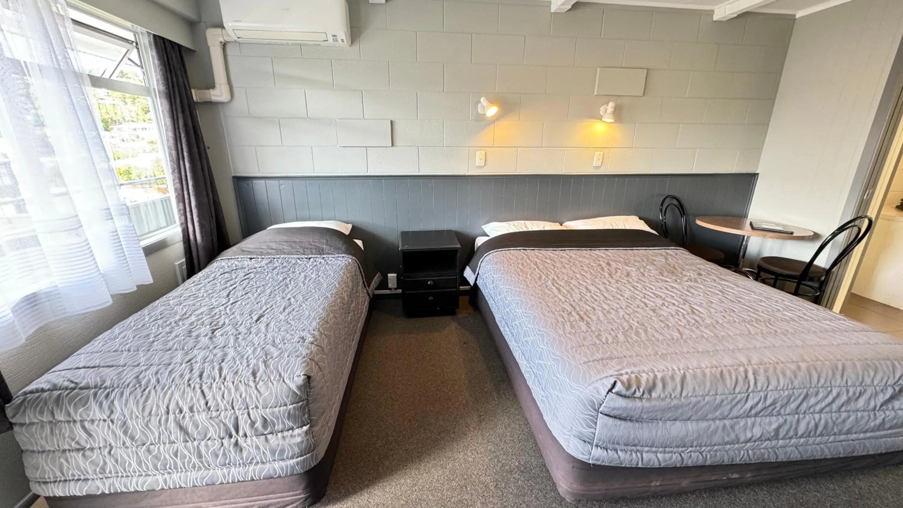 Bed in Central Court Motel