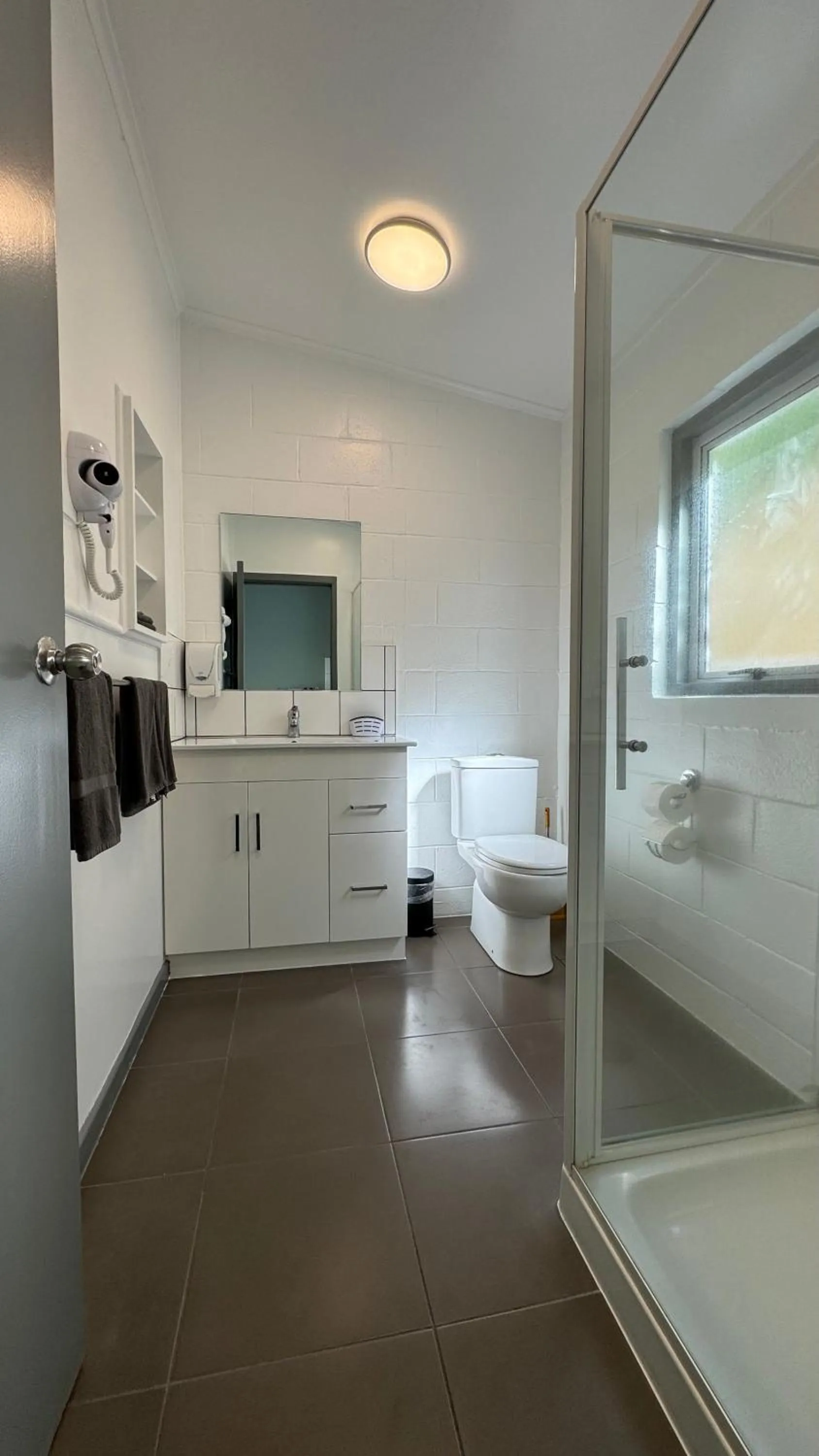 Toilet in Central Court Motel