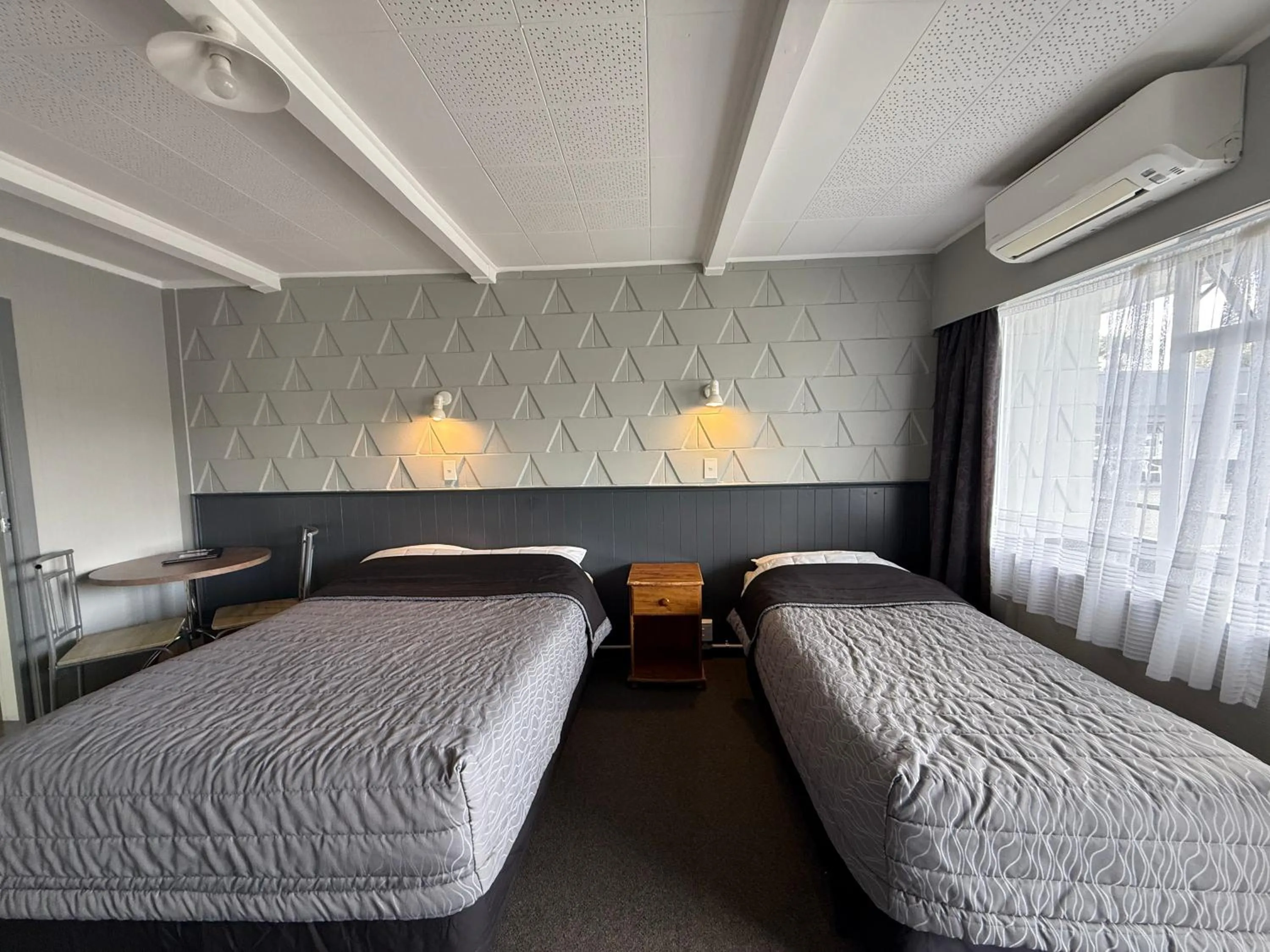 Bed in Central Court Motel