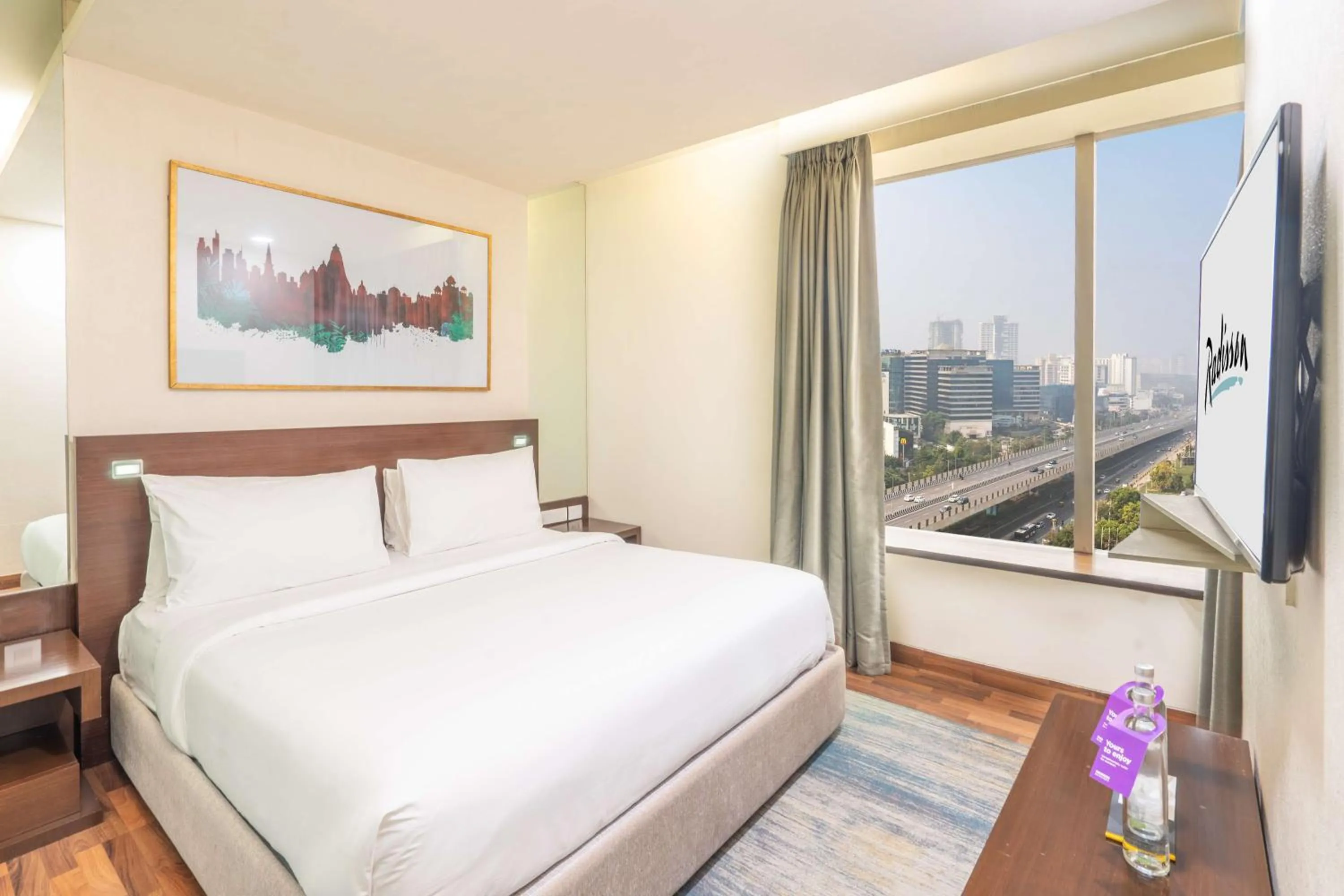 Photo of the whole room, Bed in Radisson Gurugram Sohna Road City Center