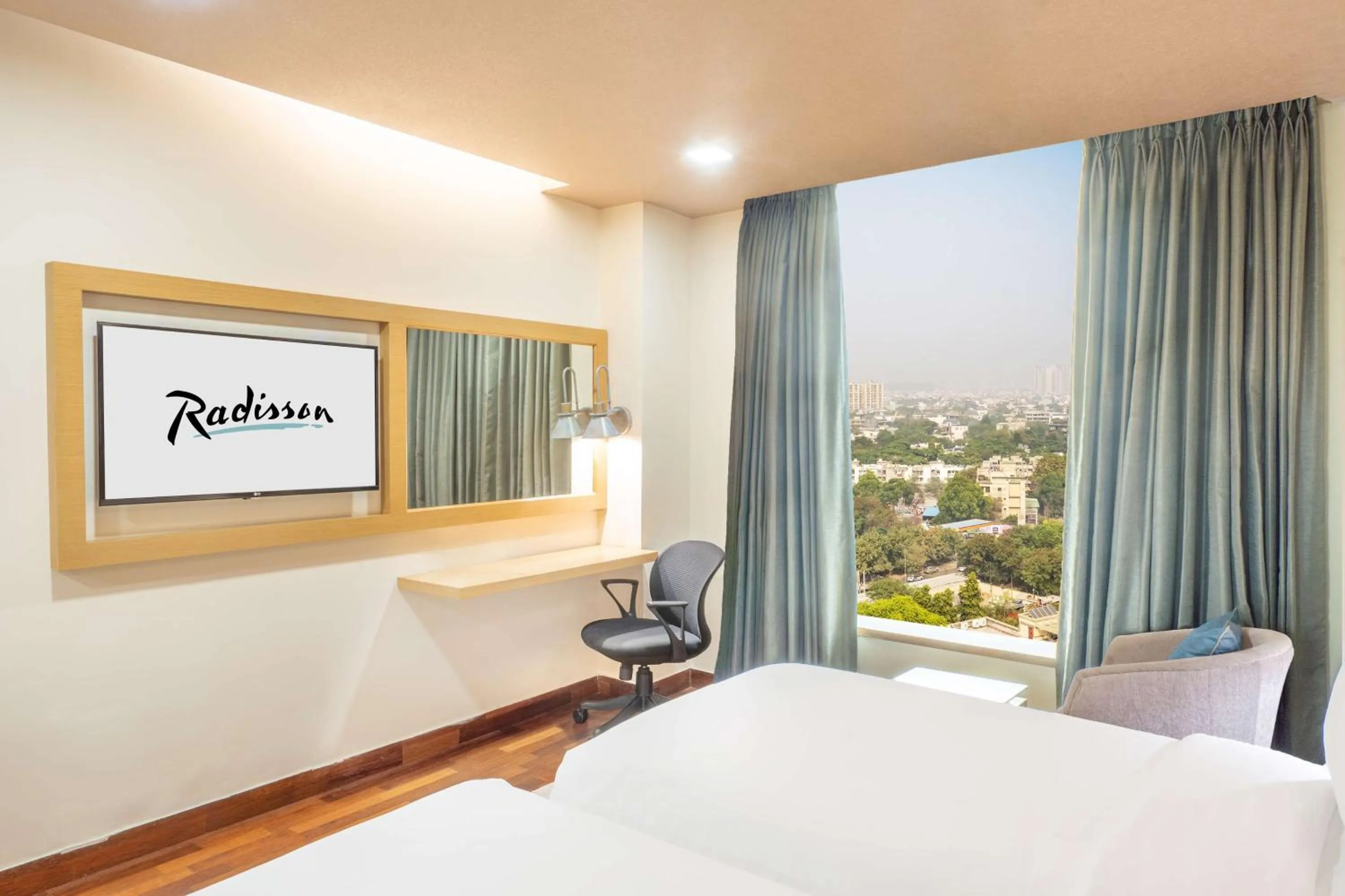 Bedroom, Bed in Radisson Gurugram Sohna Road City Center