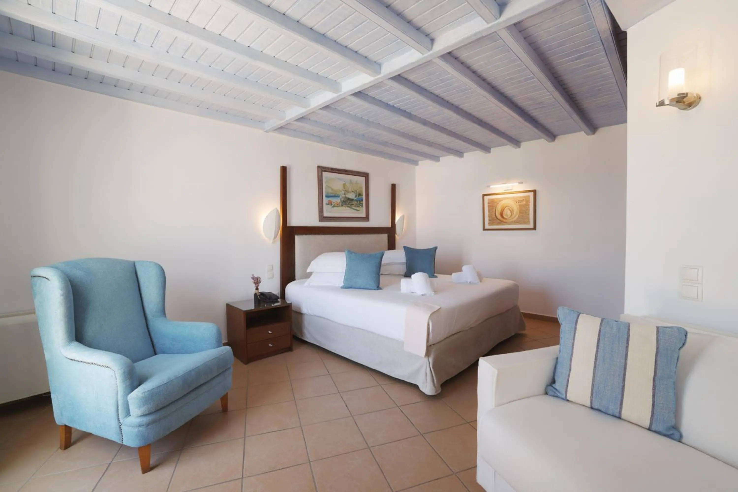 Bed in Poseidon Hotel Suites