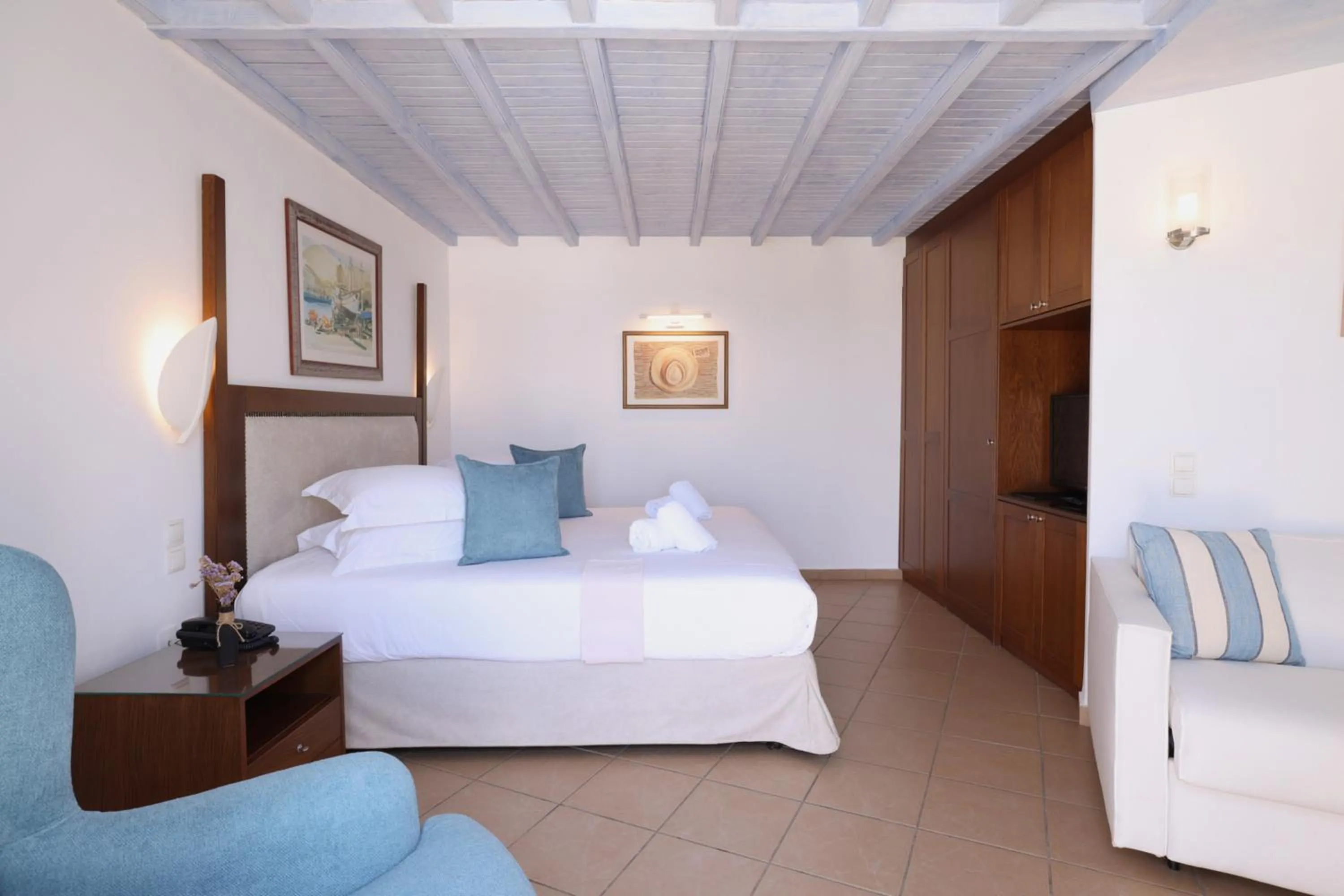 Bed in Poseidon Hotel Suites