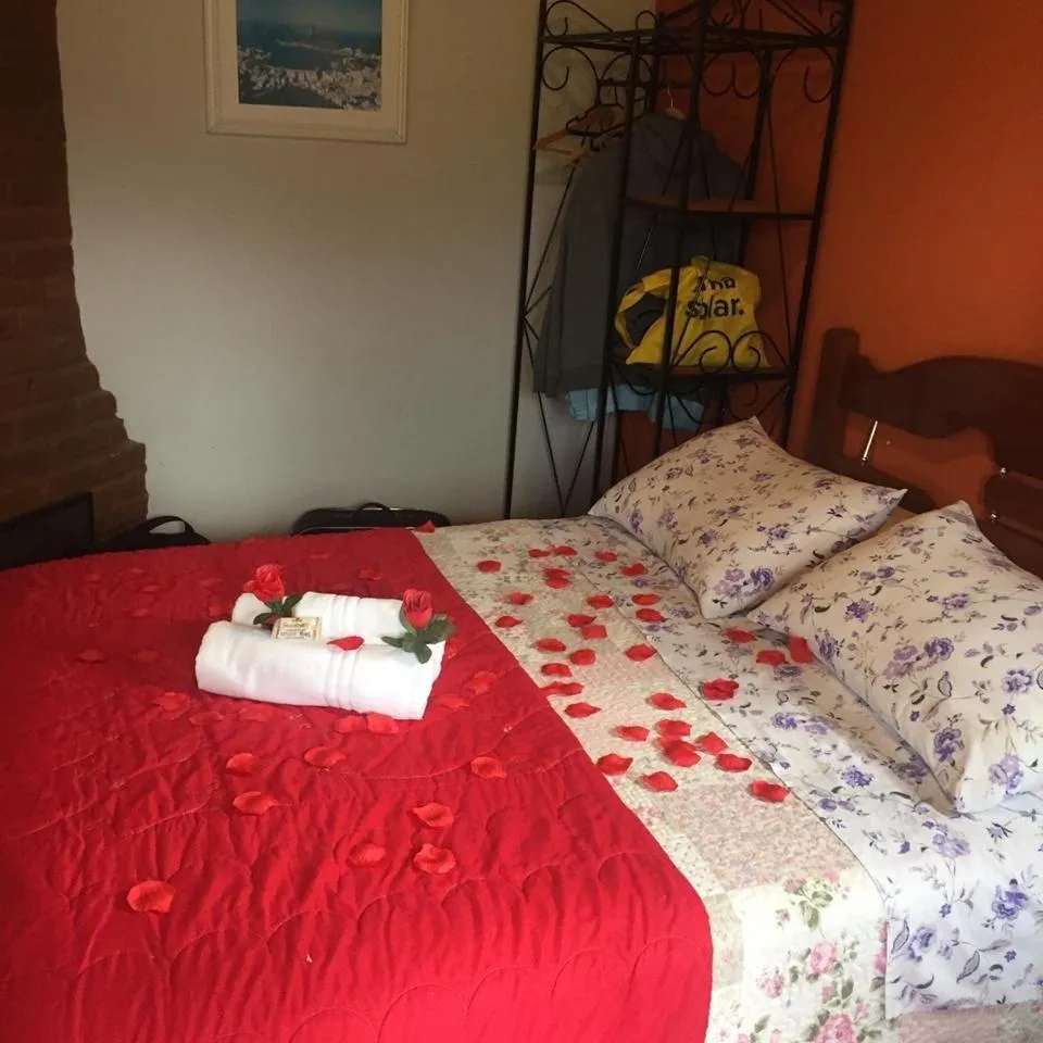 Bed in Pousada Sol Nascente