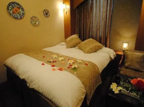 Bed in ホテル マリオン 鈴鹿