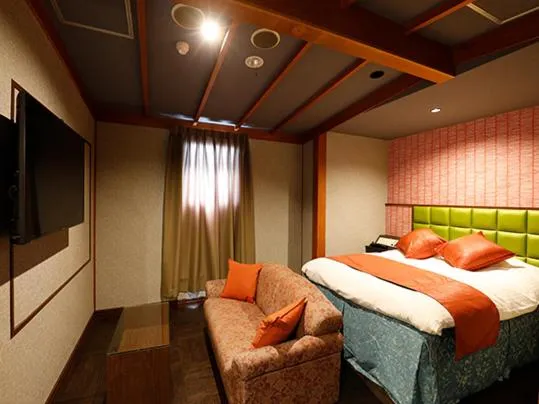 Bed in ホテル マリオン 鈴鹿