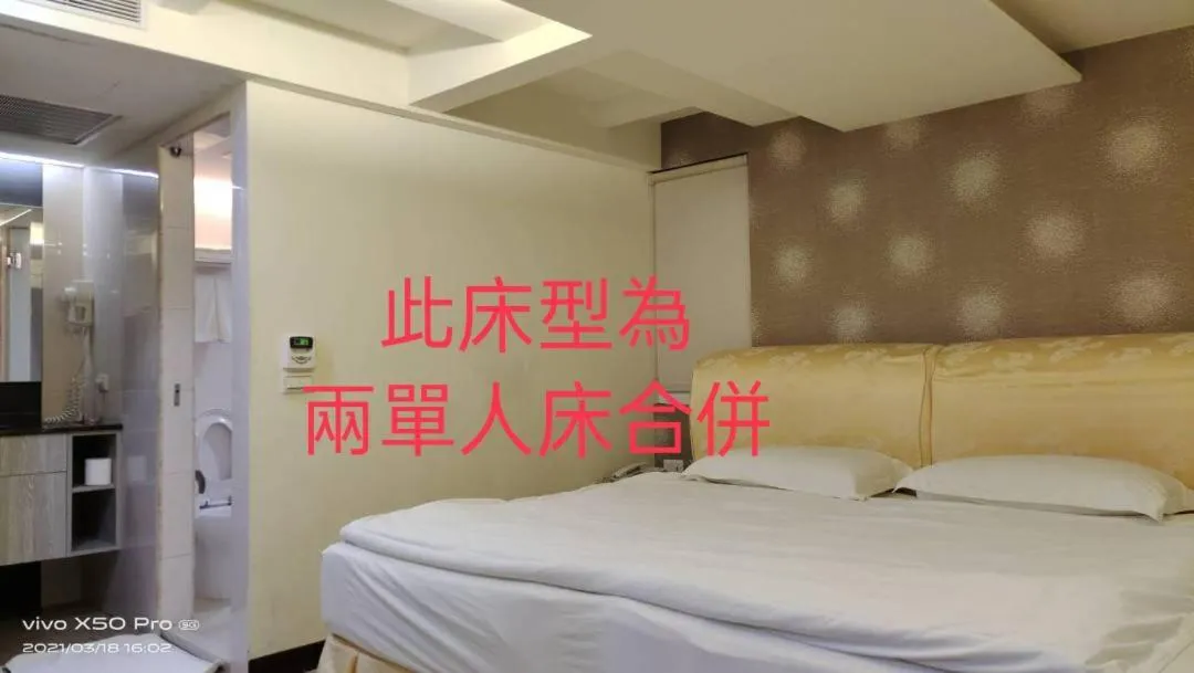 Bed in 德瑞旅店Direct Hotel