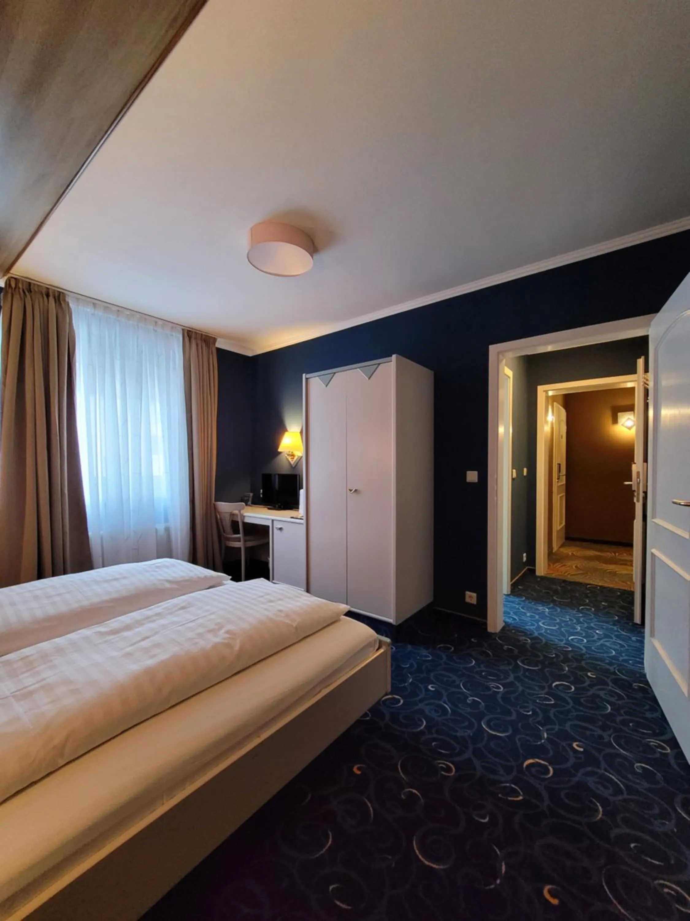 Bed in Ambiente Hotel garni