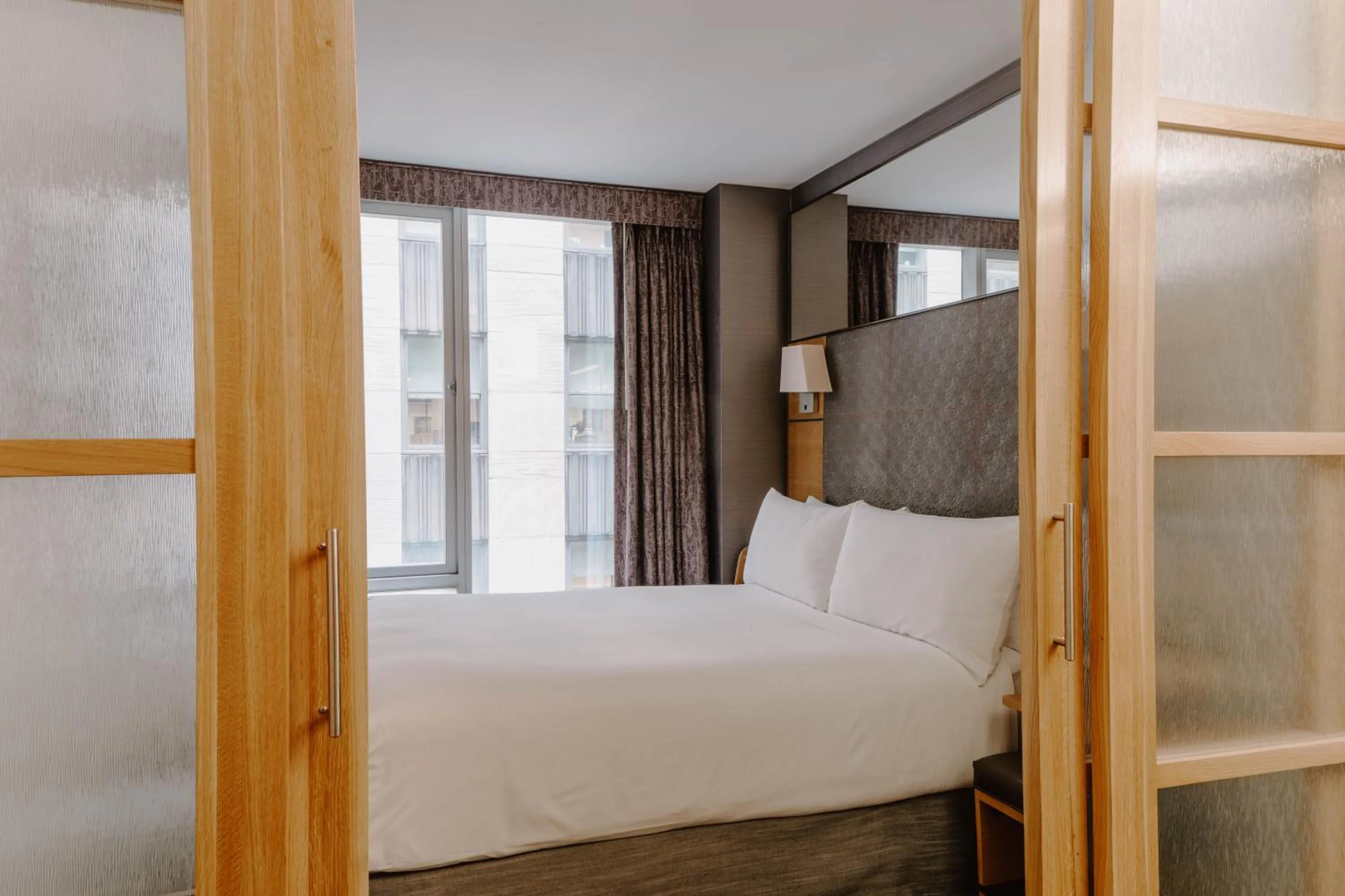 Bed in The Jewel Hotel, New York