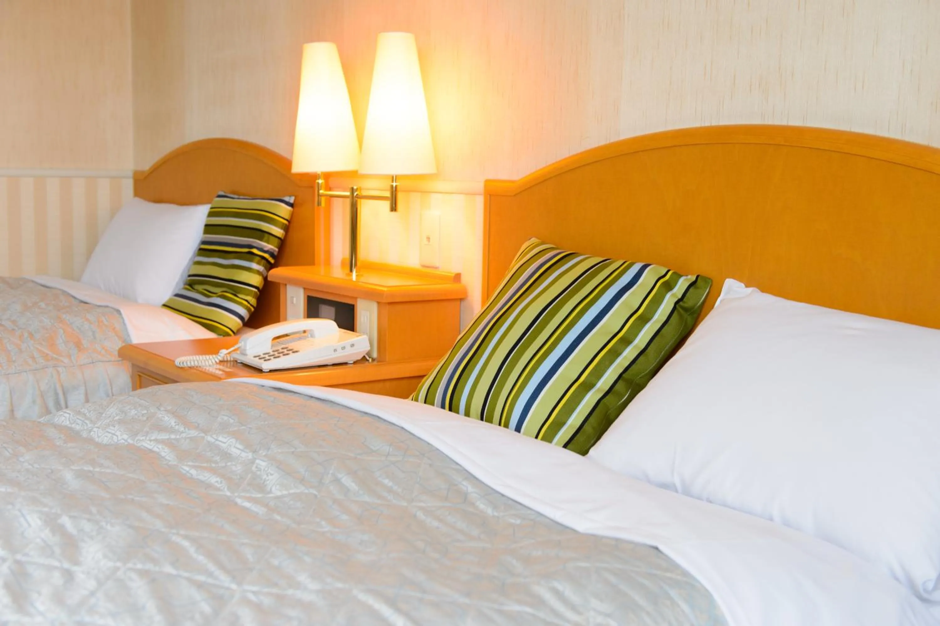 Bed in Hotel Grand Plaza Urashima