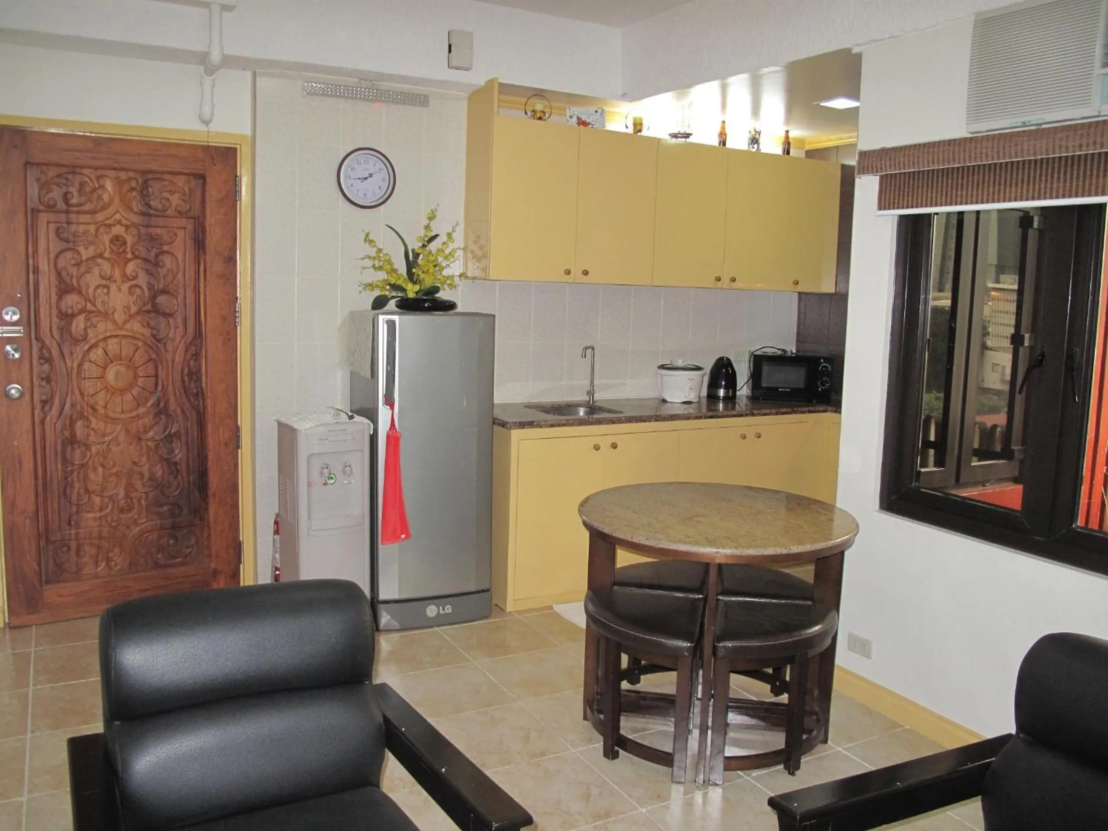 Kitchen or kitchenette in Makati Suites at Travelers Inn