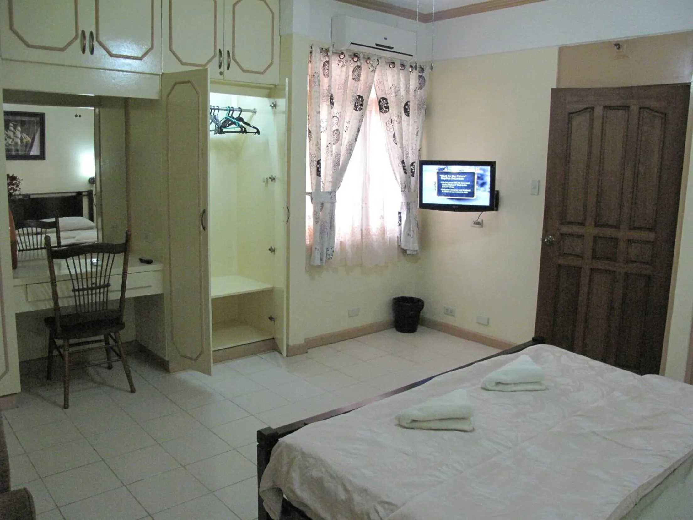 Bed in Makati Suites at Travelers Inn