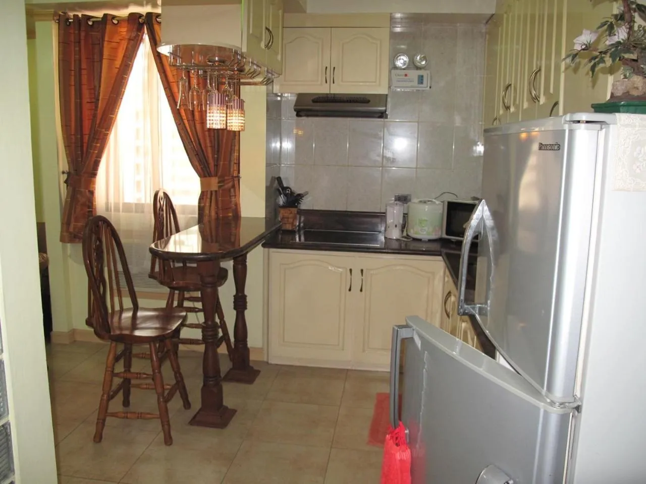 Kitchen or kitchenette in Makati Suites at Travelers Inn