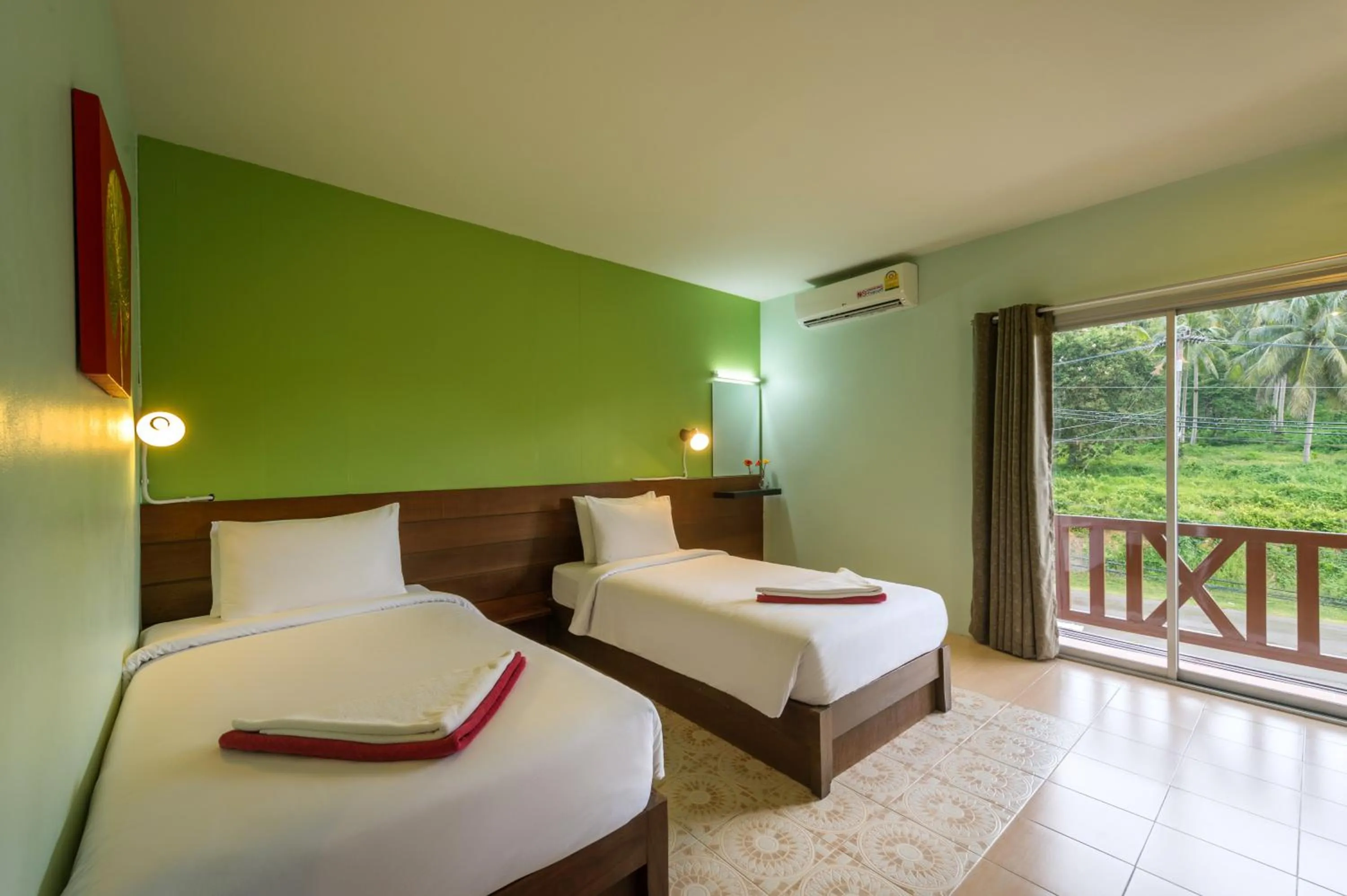 Bed in Lanta Thip House by Swiss-Belhotel - SHA Plus