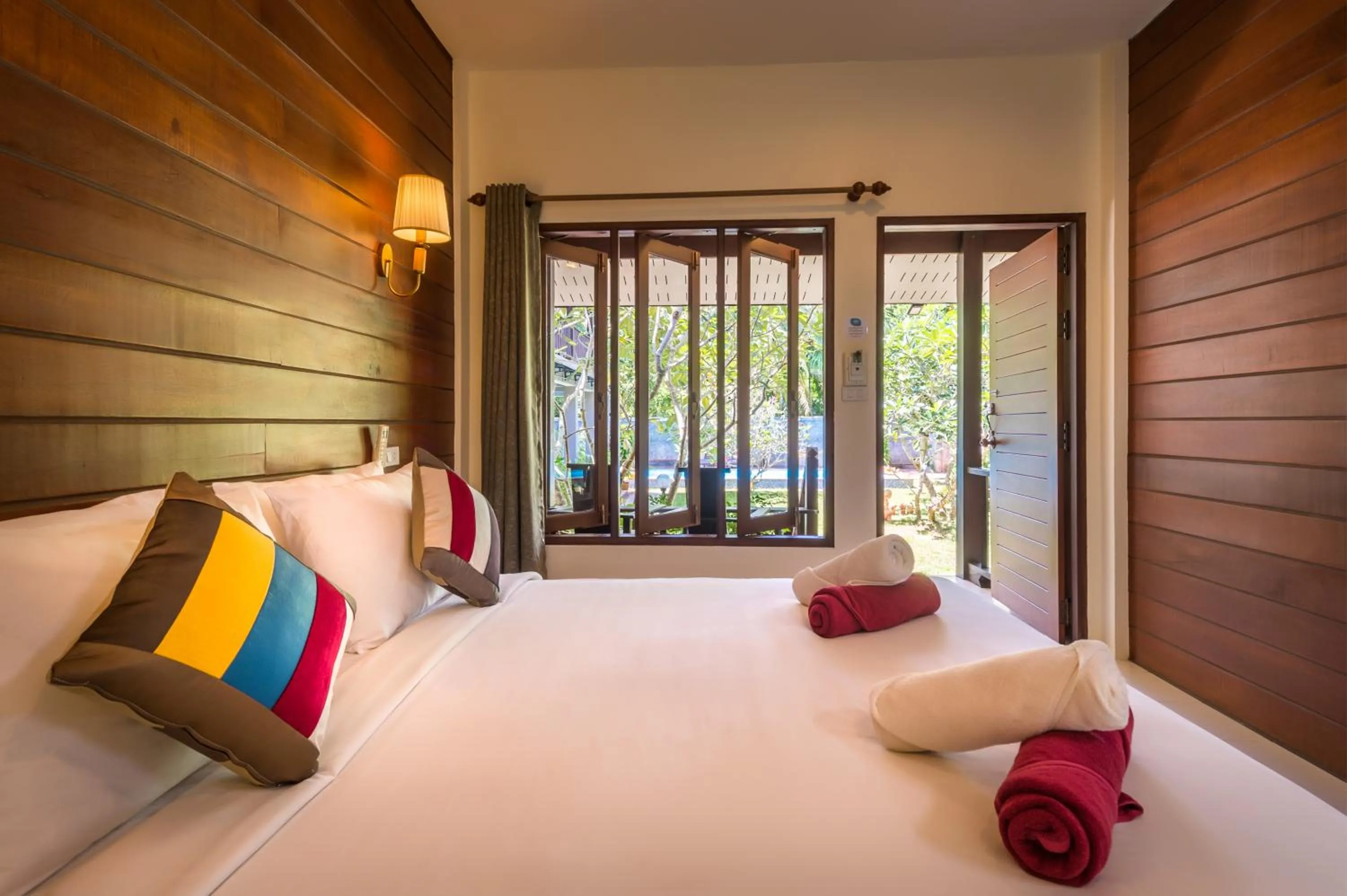 Bed in Lanta Thip House by Swiss-Belhotel - SHA Plus