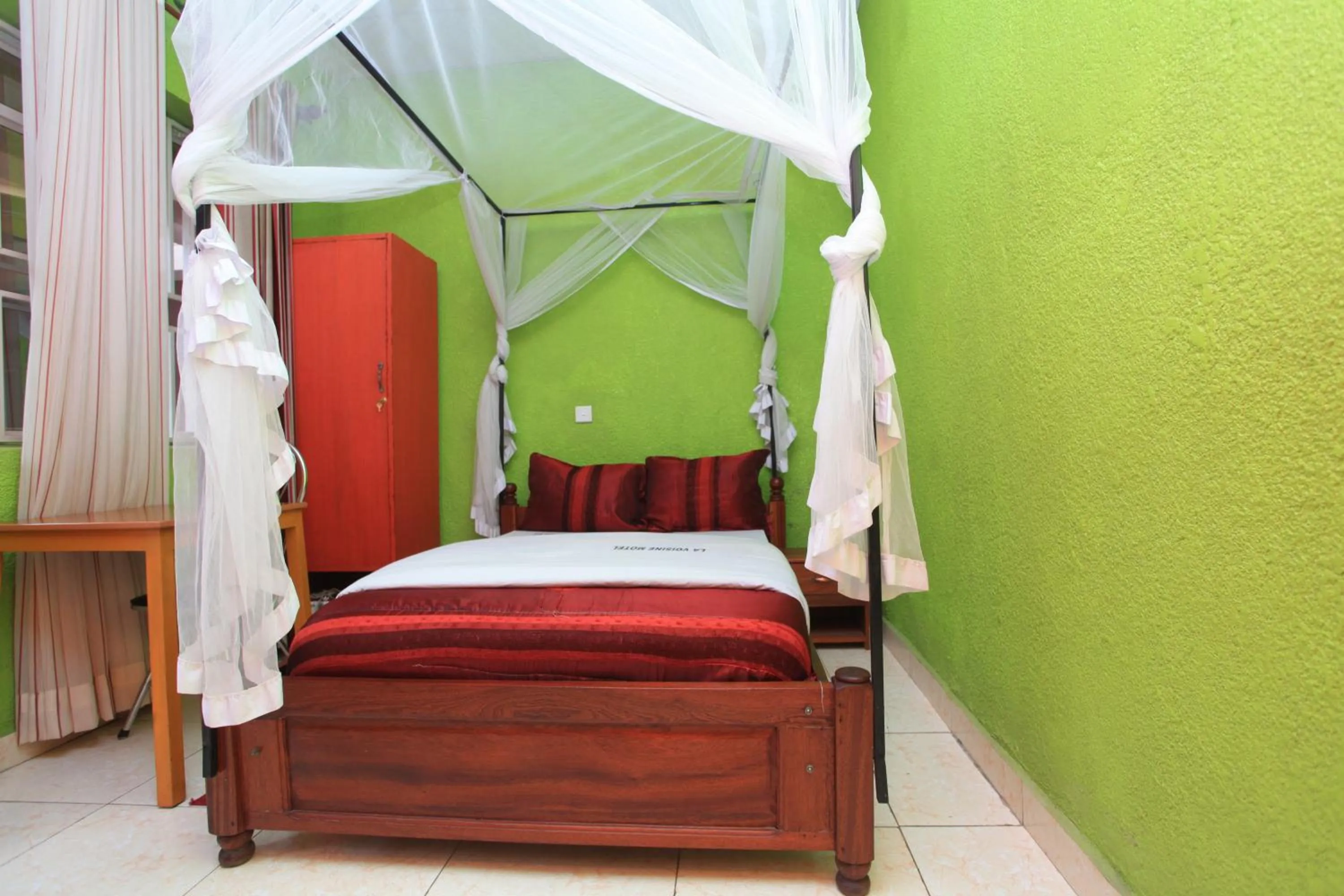 Bed in La Voisina Hotel