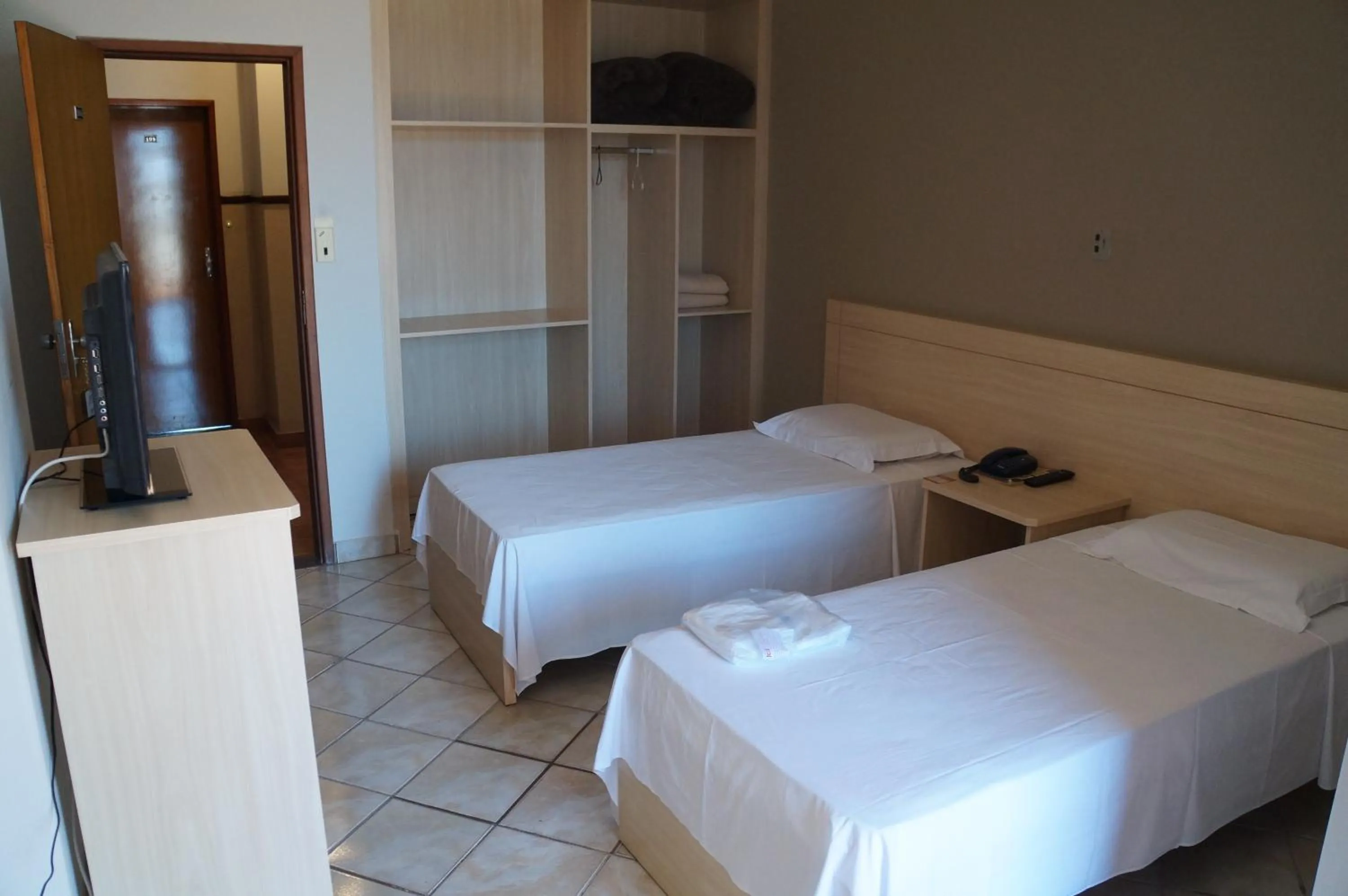 Bed in Manhuaçu Center Hotel