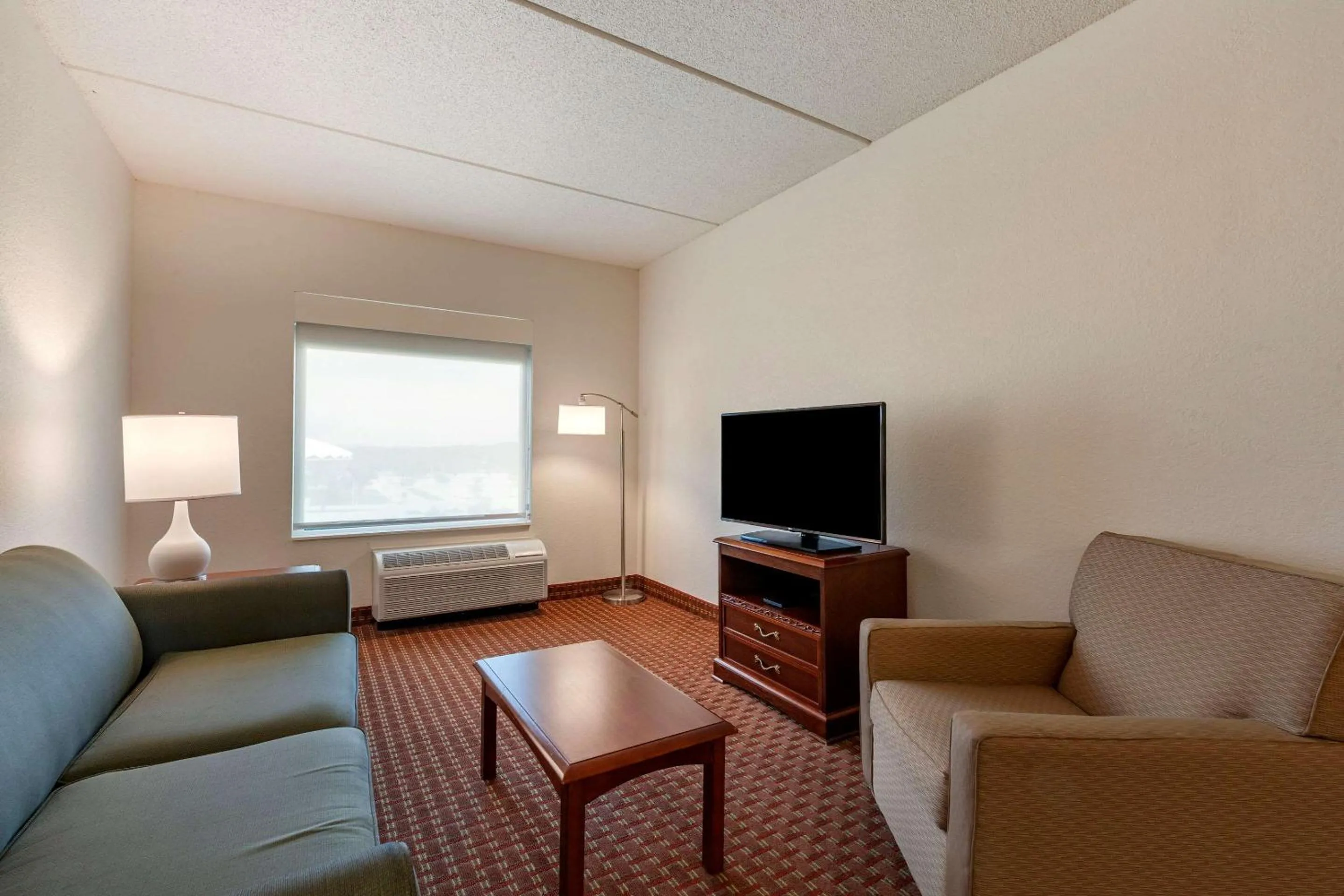 Bedroom in Clarion Suites at The Alliant Energy Center