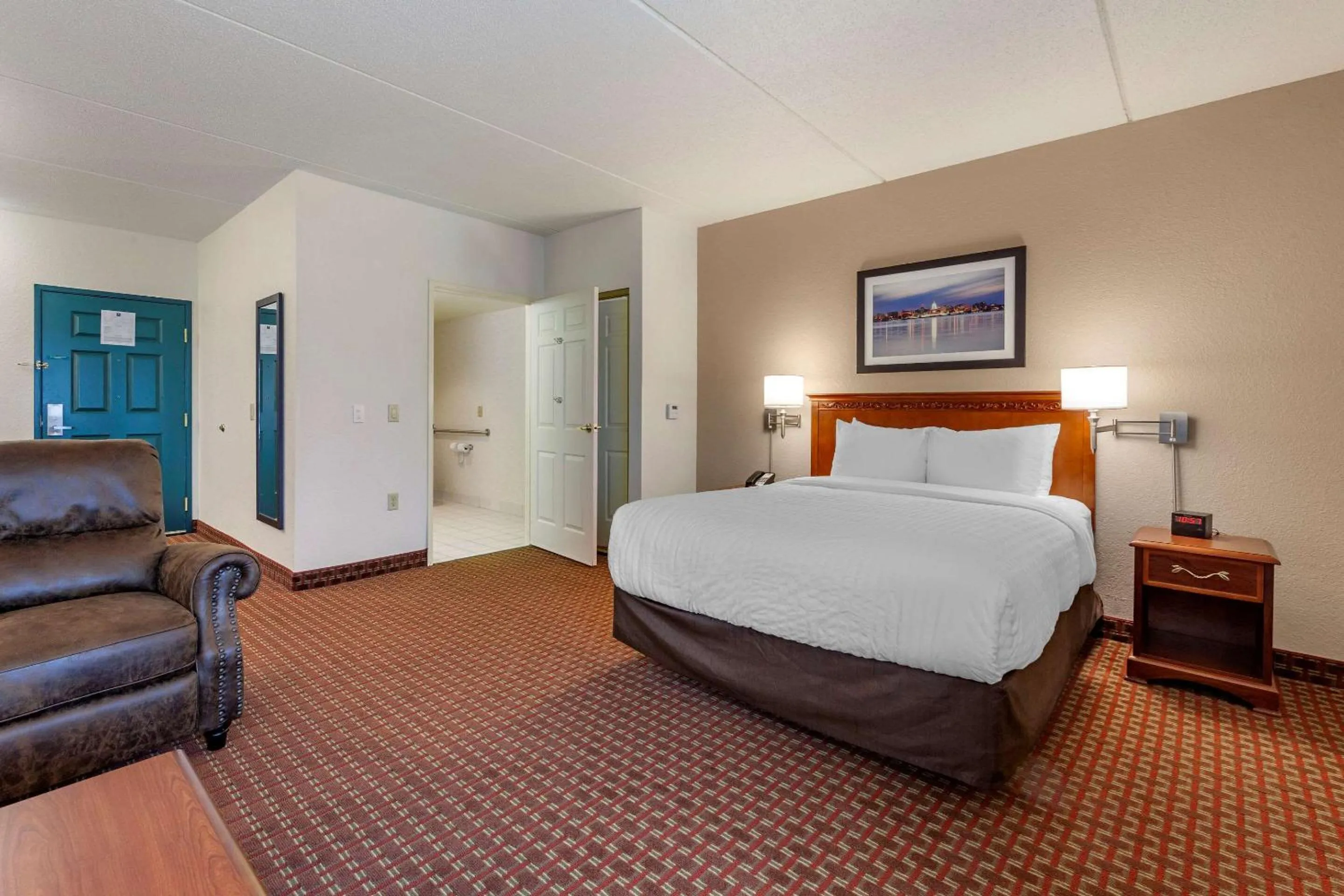 Bedroom in Clarion Suites at The Alliant Energy Center