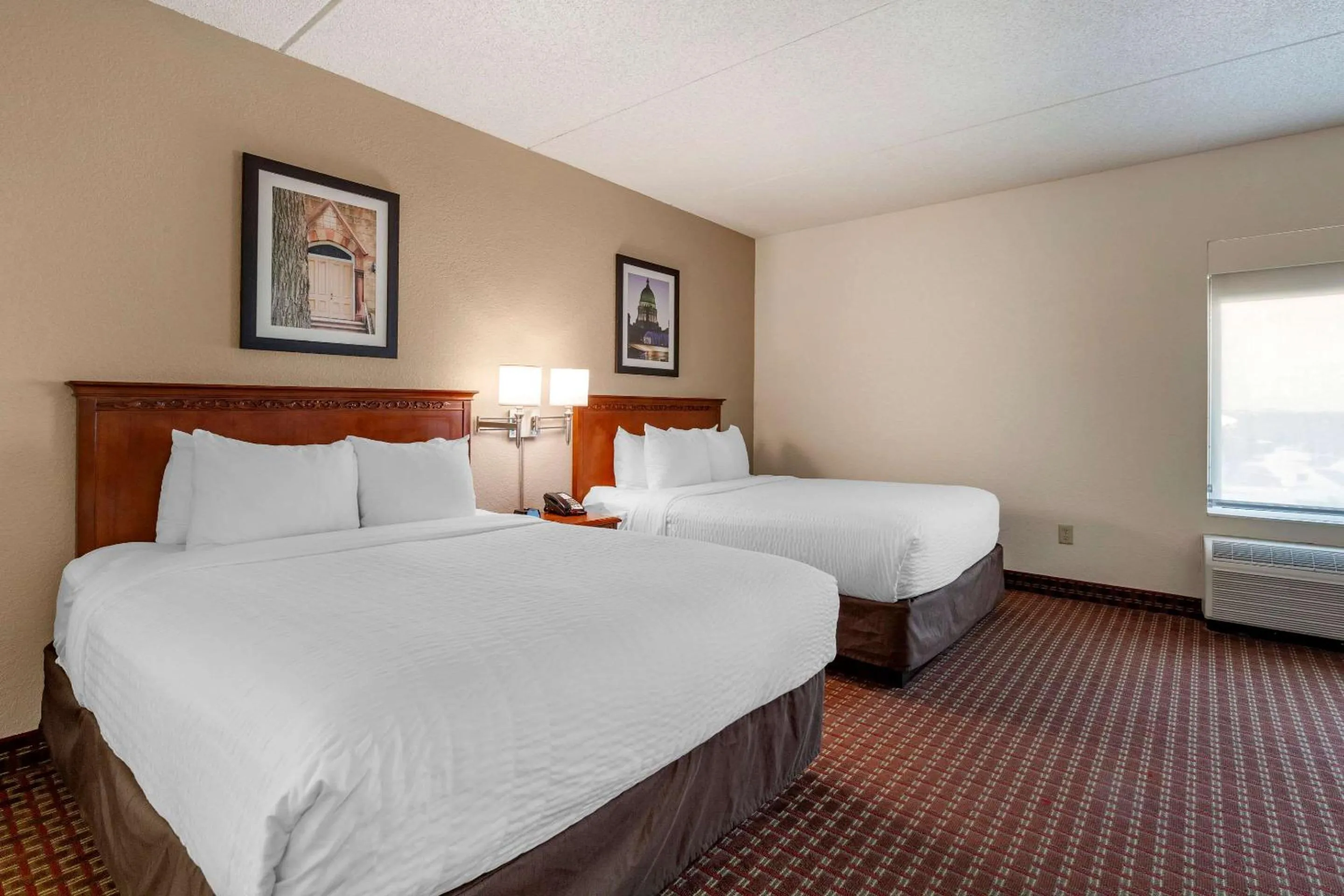 Bedroom in Clarion Suites at The Alliant Energy Center