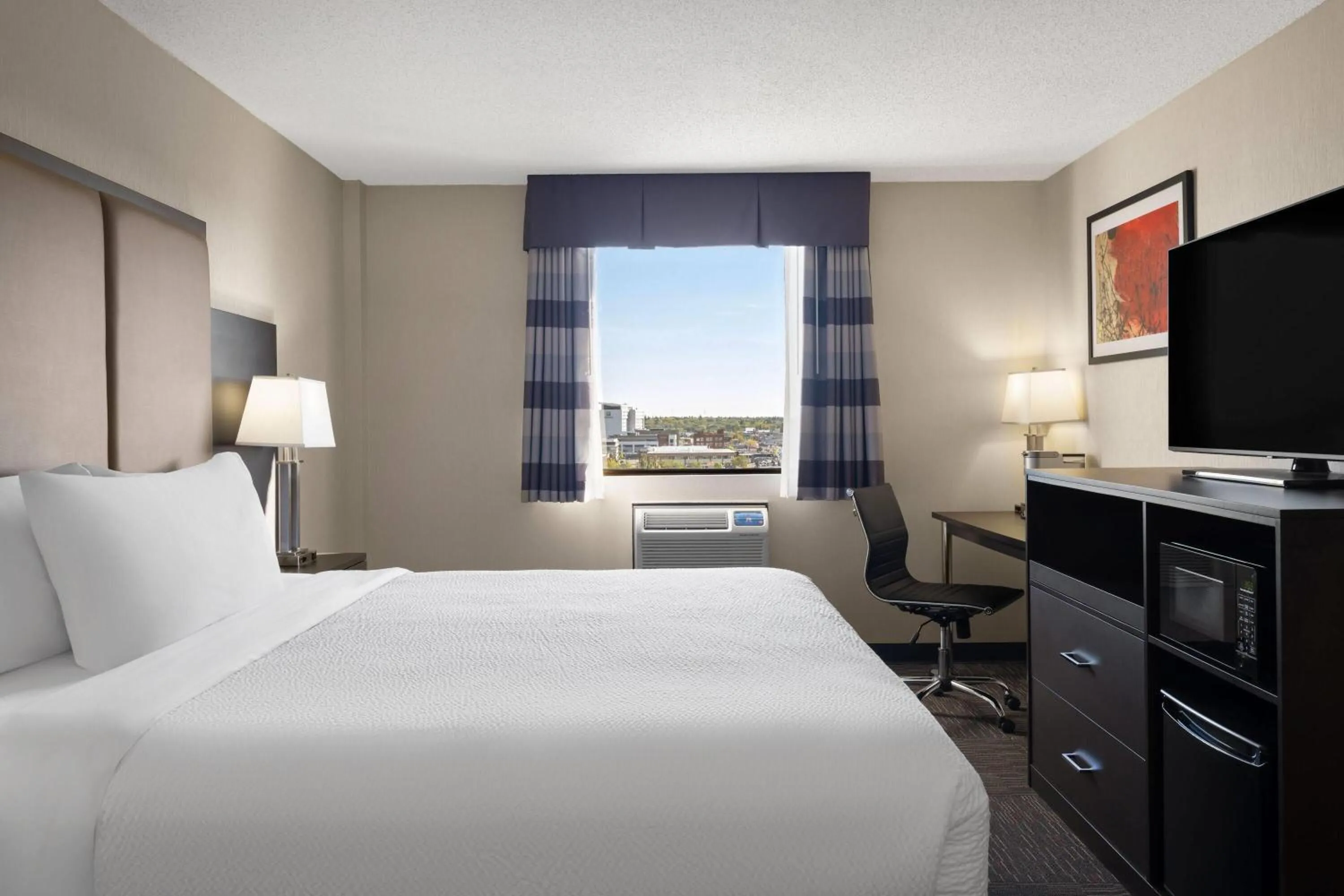 Photo of the whole room, Bed in Ramada by Wyndham Saskatoon