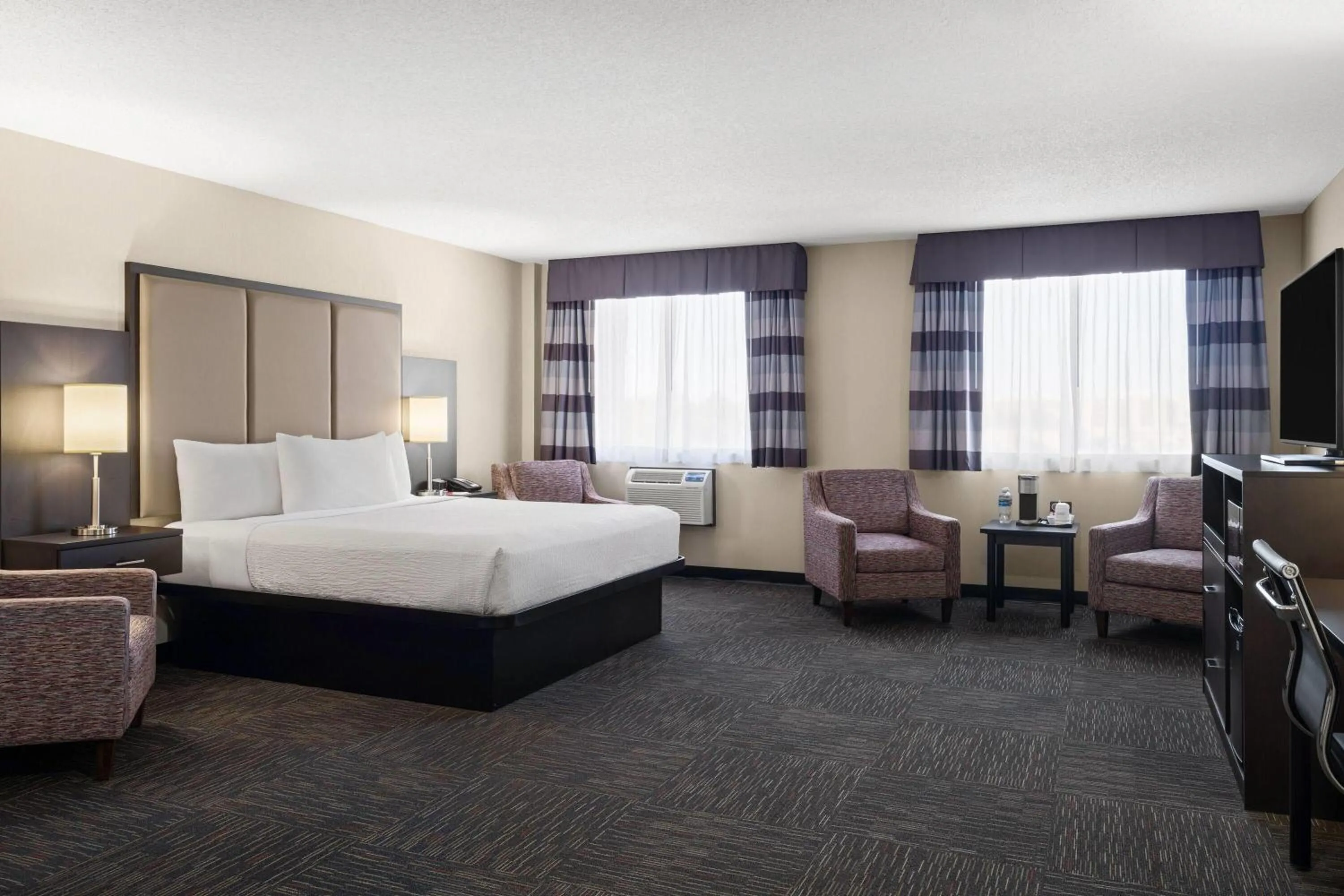 Photo of the whole room, Bed in Ramada by Wyndham Saskatoon