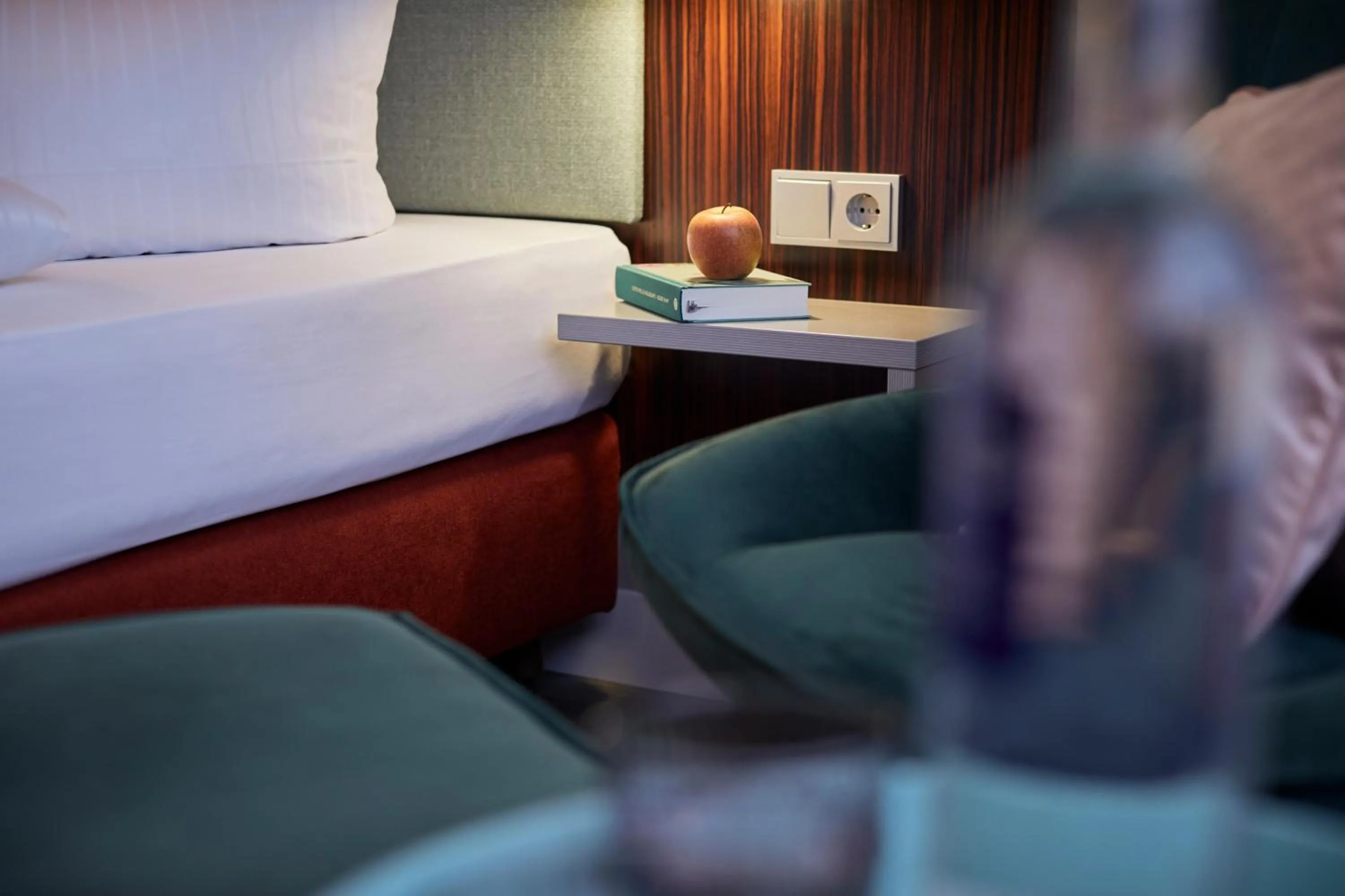 Seating area, Bed in Hotel Metropol by Maier Privathotels