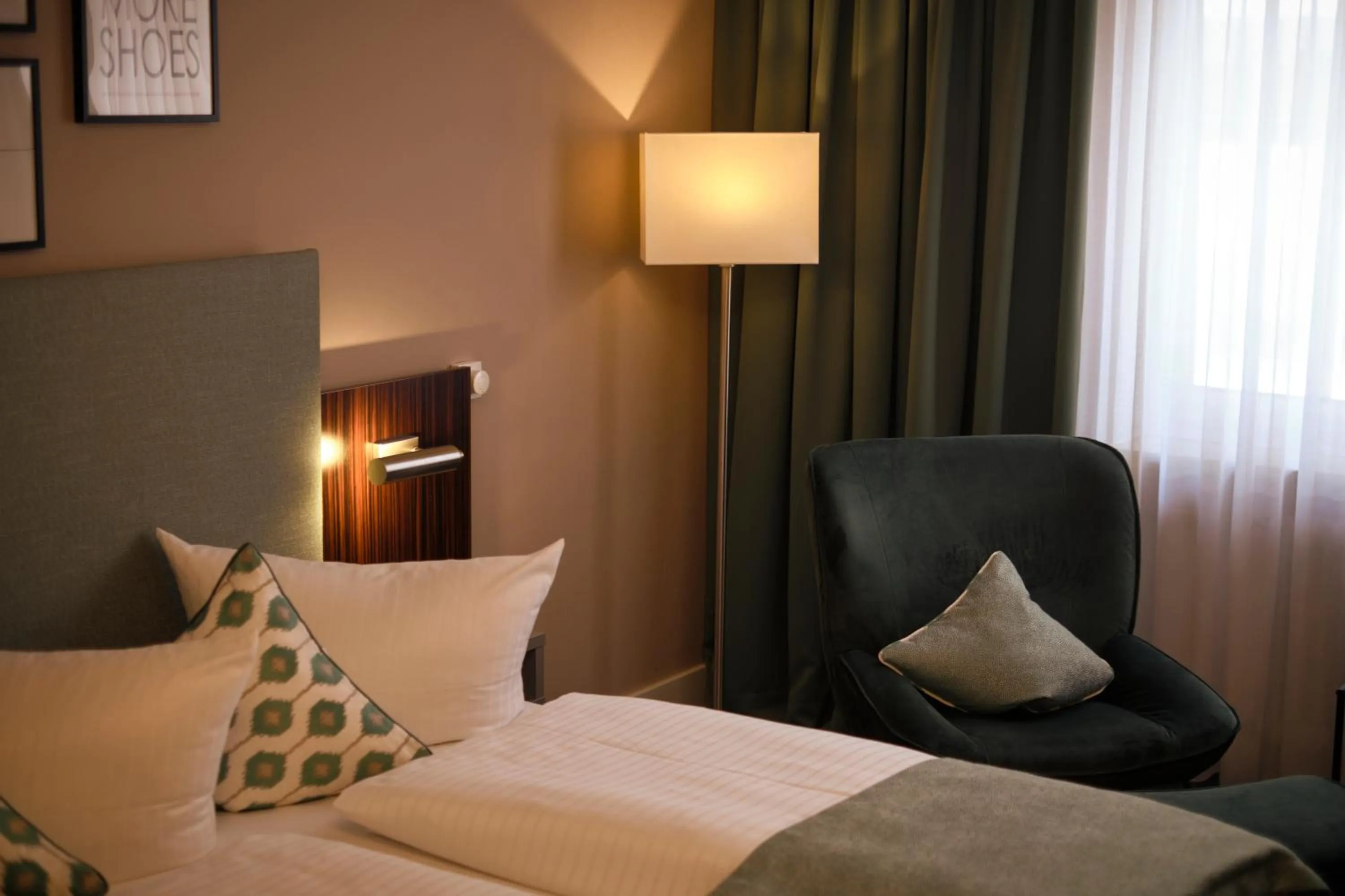 Seating area, Bed in Hotel Metropol by Maier Privathotels