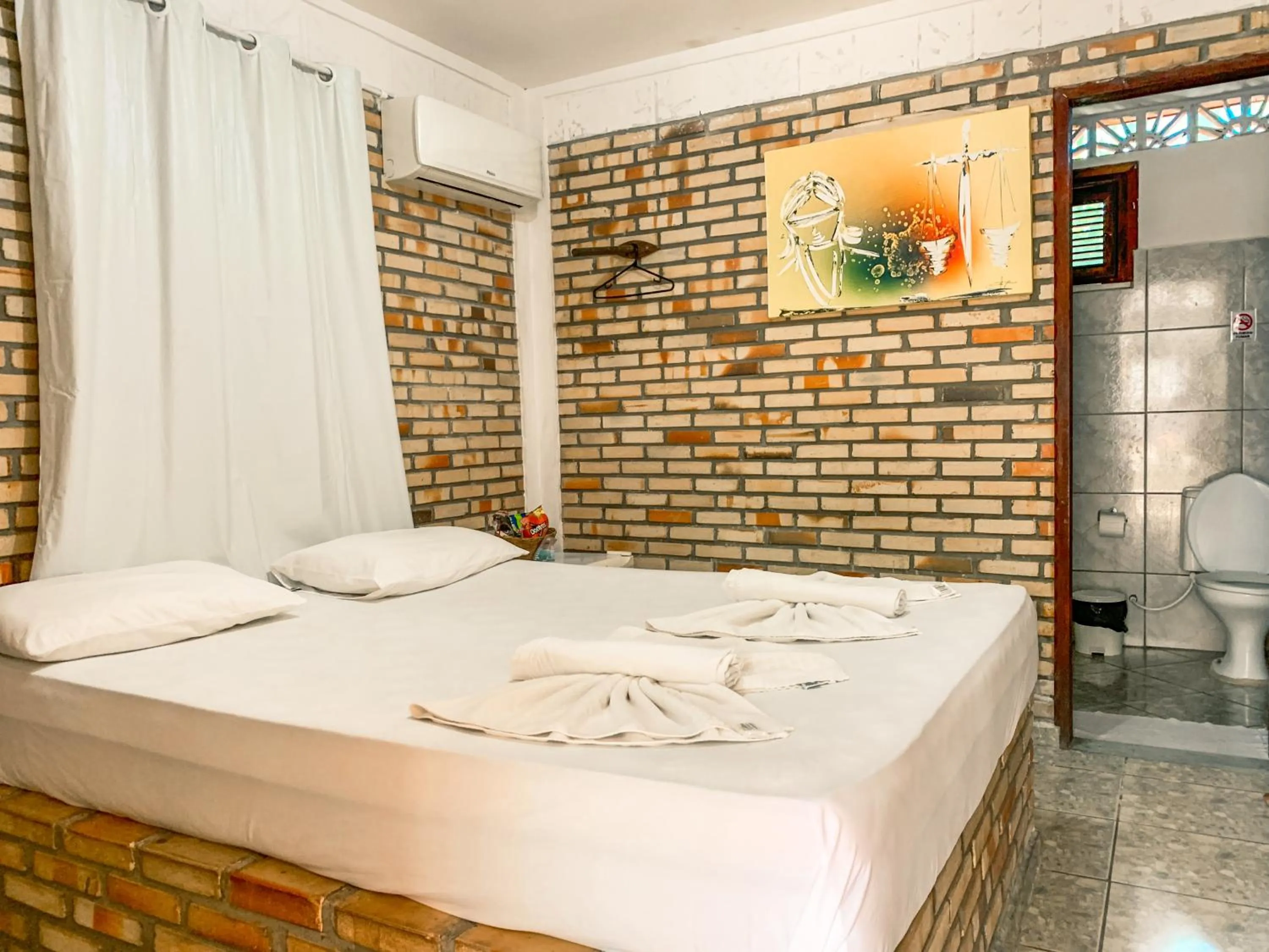 Bed in Pousada La Goduria