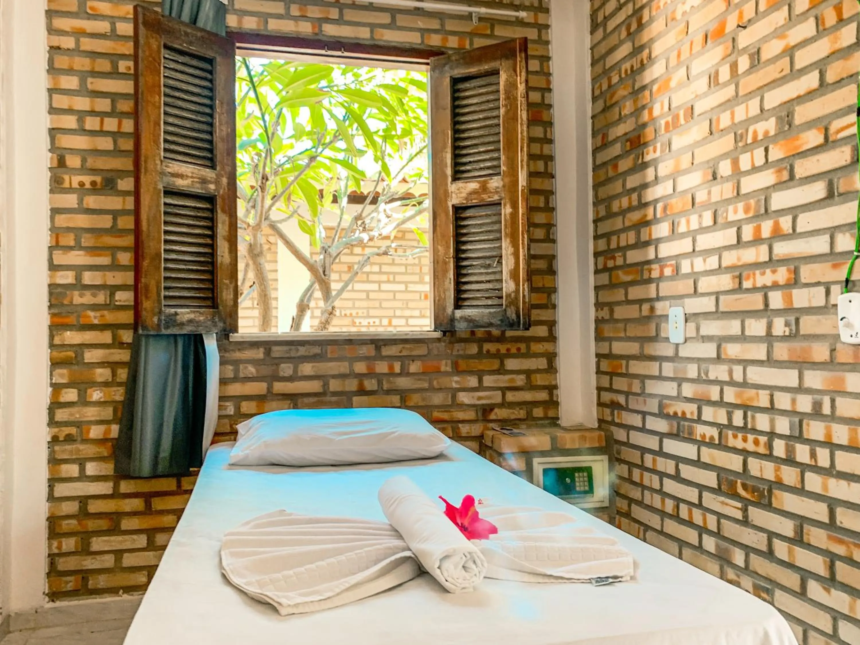 Bed in Pousada La Goduria