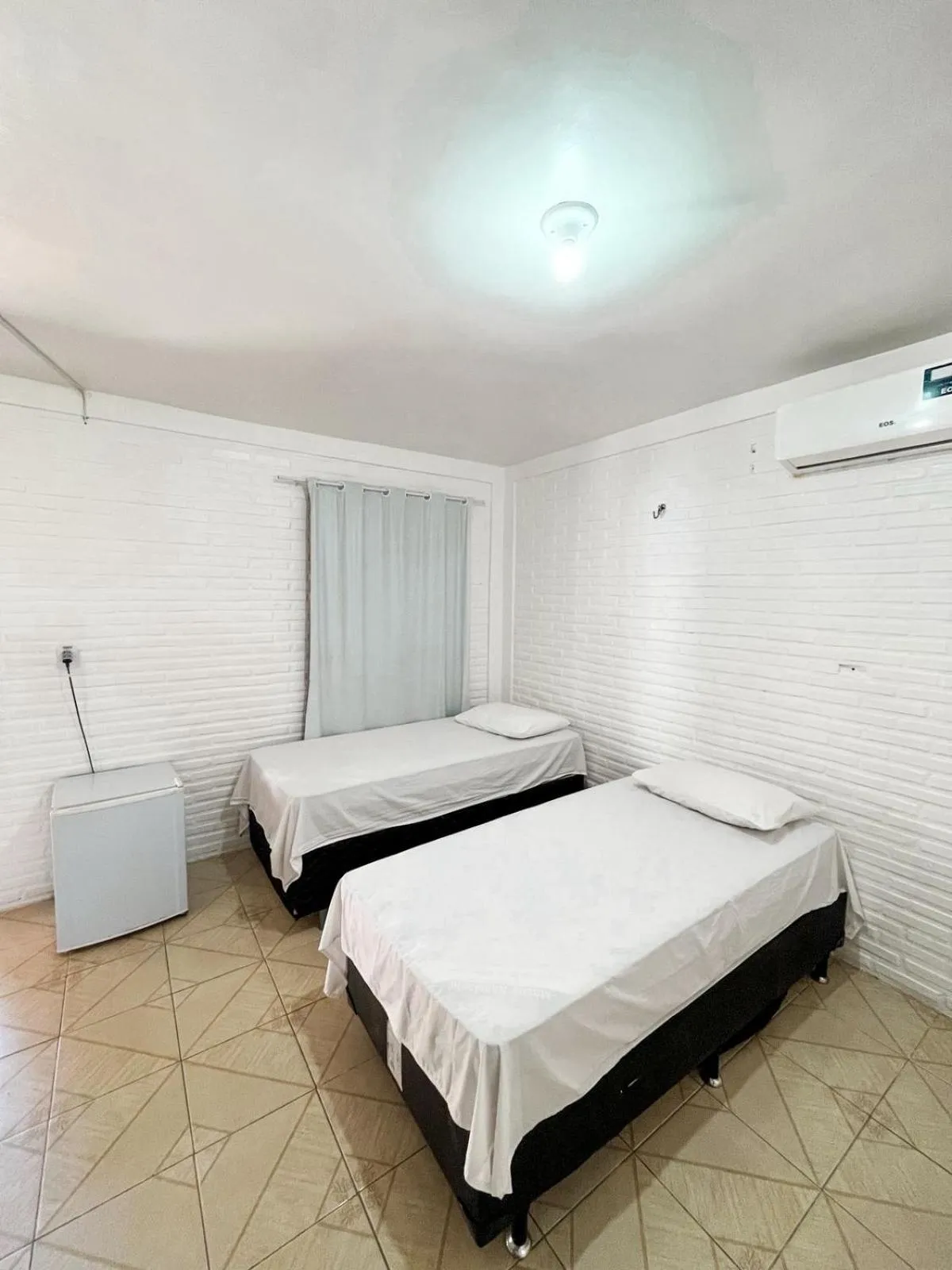 Bed in Pousada La Goduria