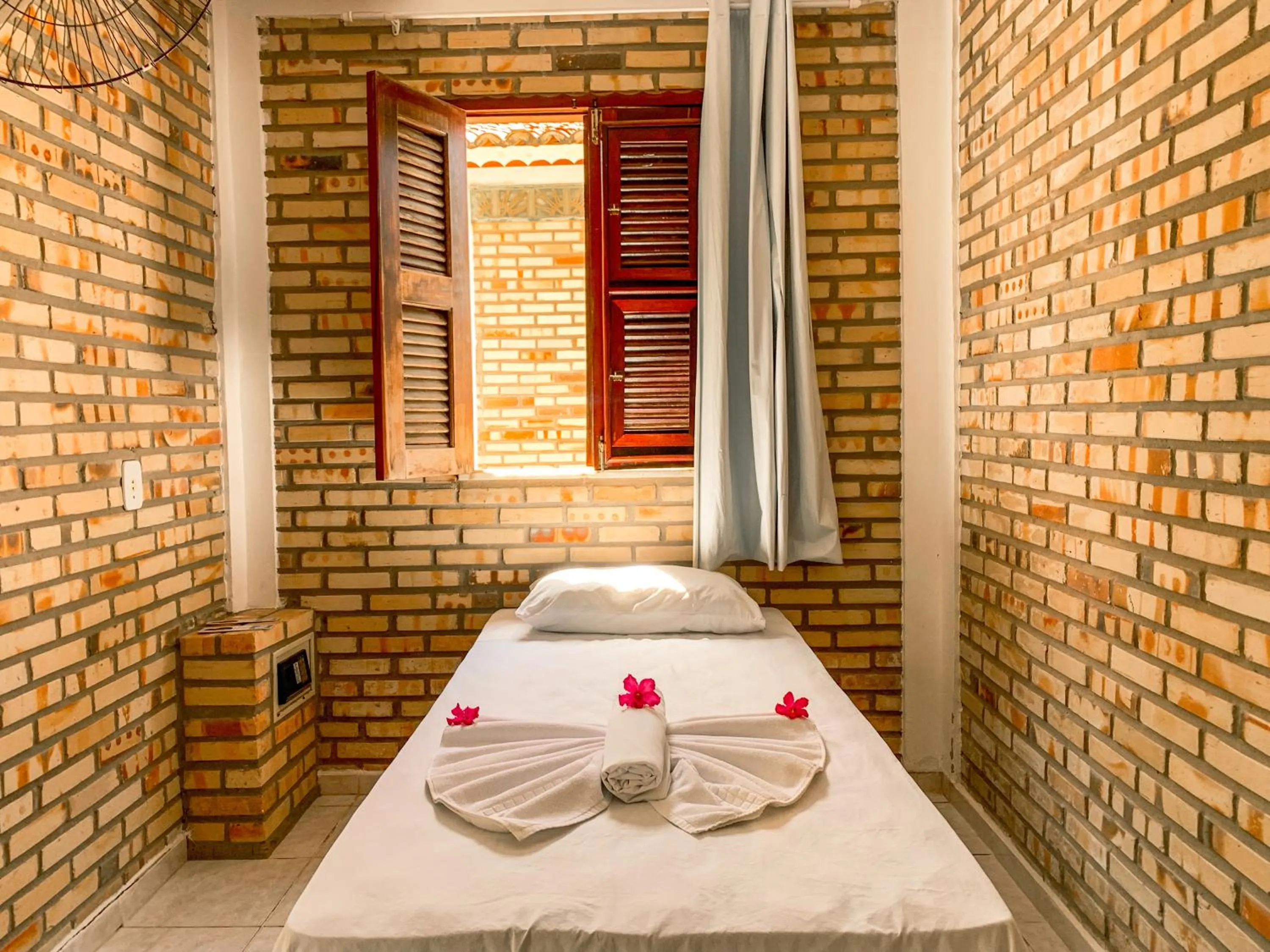 Bed in Pousada La Goduria