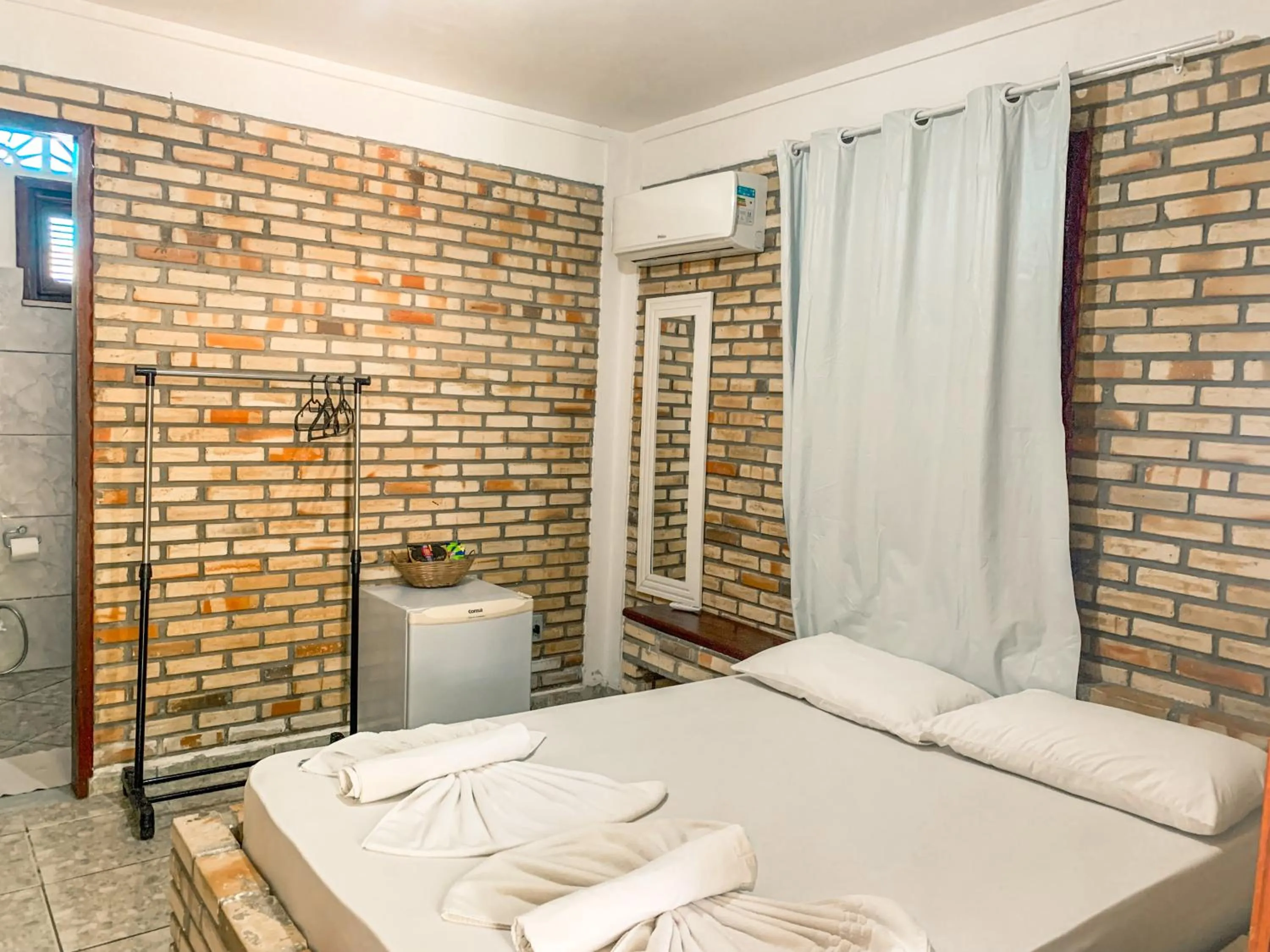 Bed in Pousada La Goduria