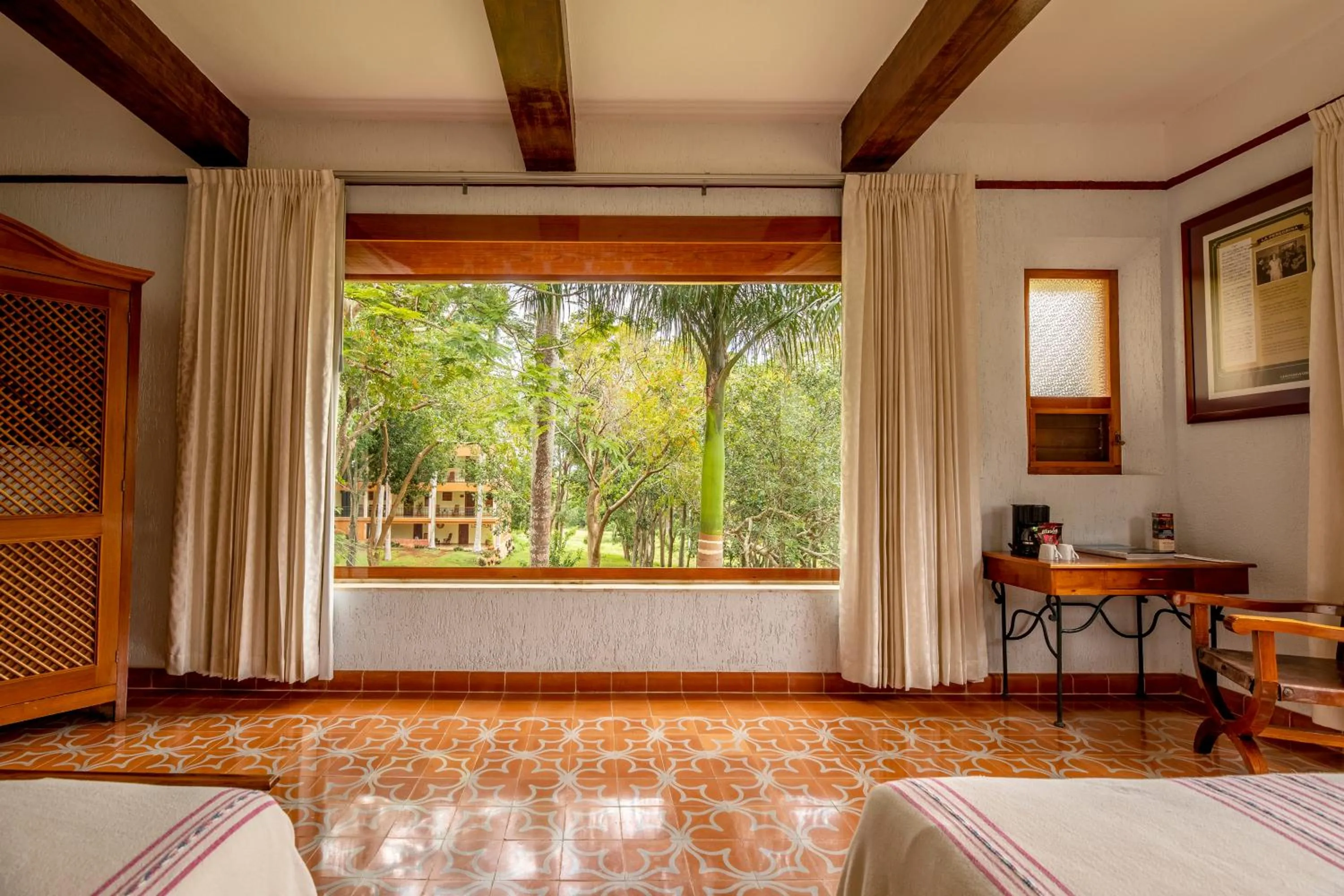 Garden view, Bed in Hacienda Uxmal Plantation & Museum