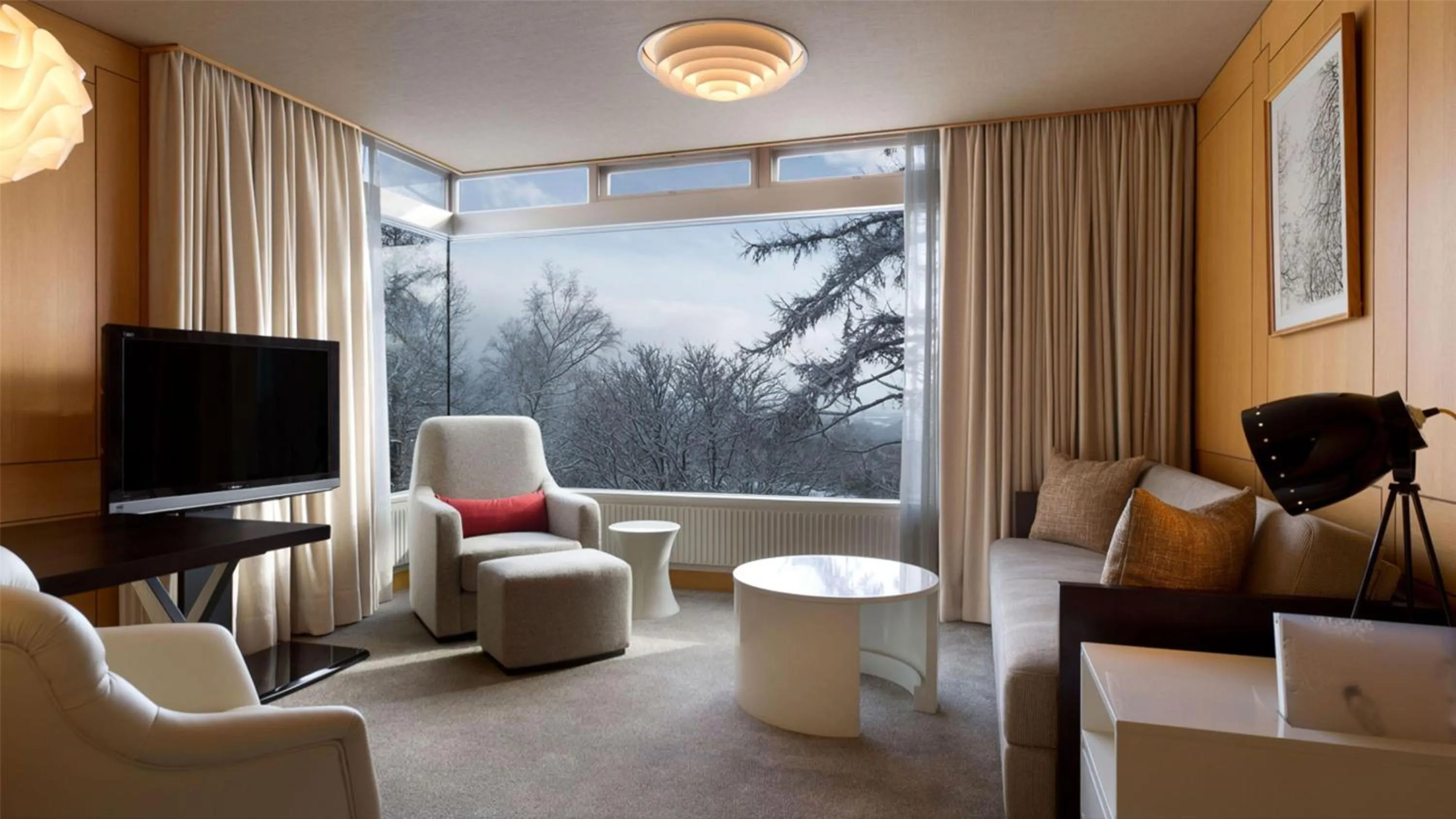 Living room in The Green Leaf Niseko Village, Tapestry Collection by Hilton