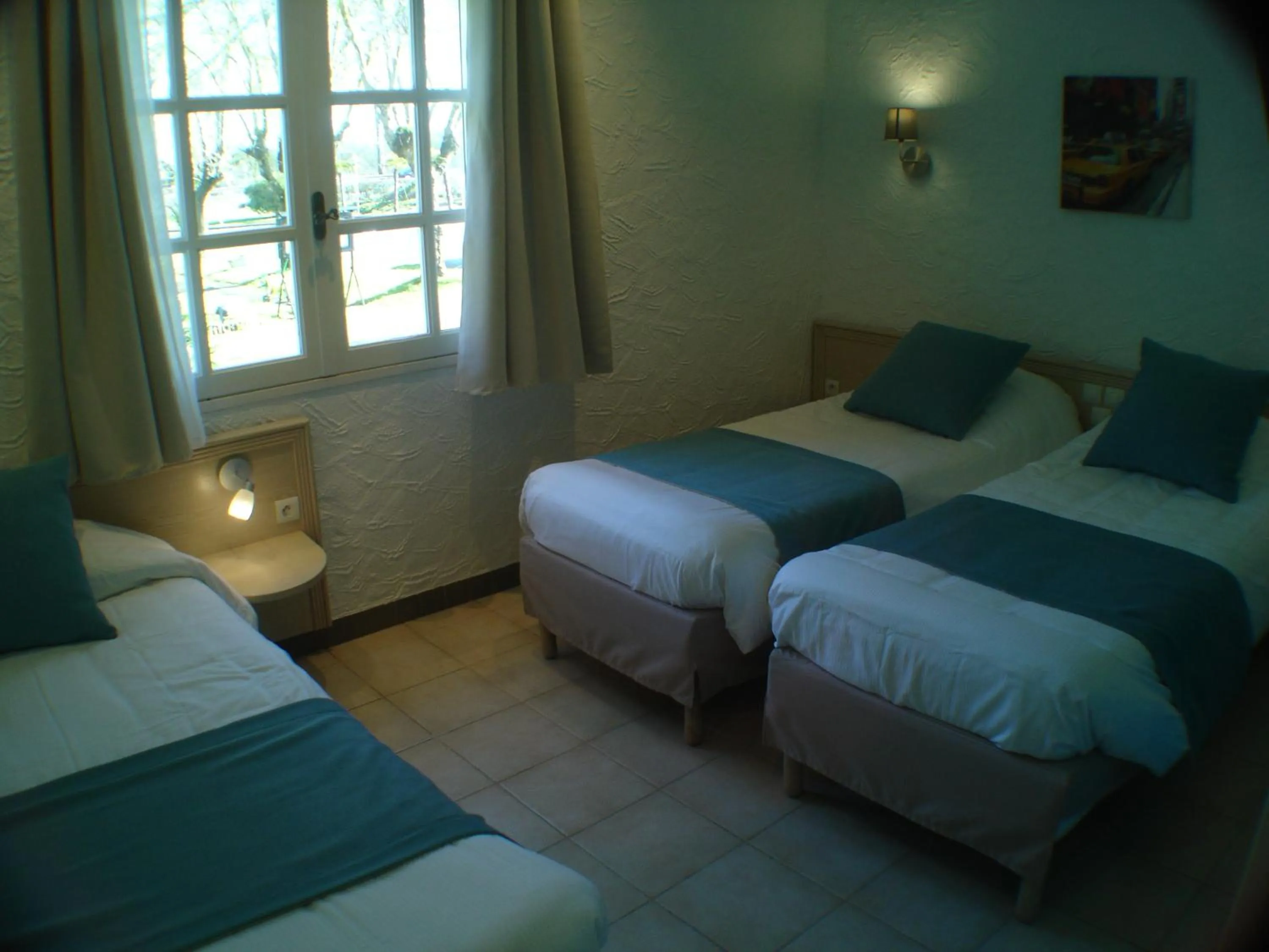 Bed in Logis Hôtel & Restaurant Le Fleurance