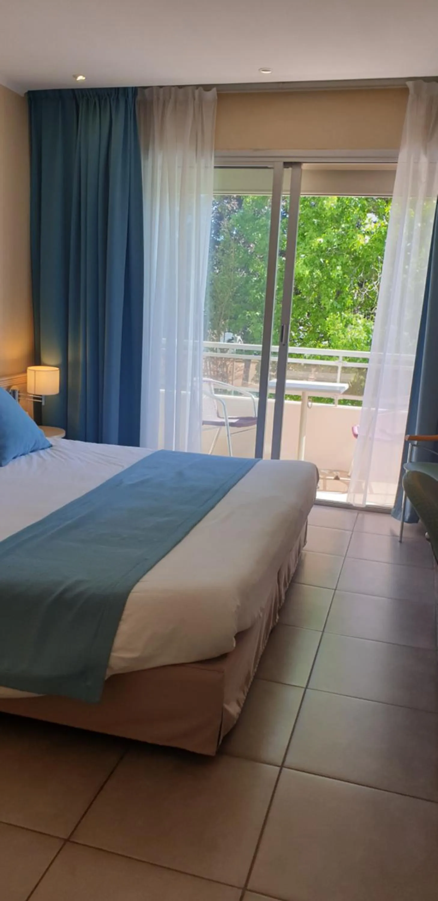 Bed in Logis Hôtel & Restaurant Le Fleurance