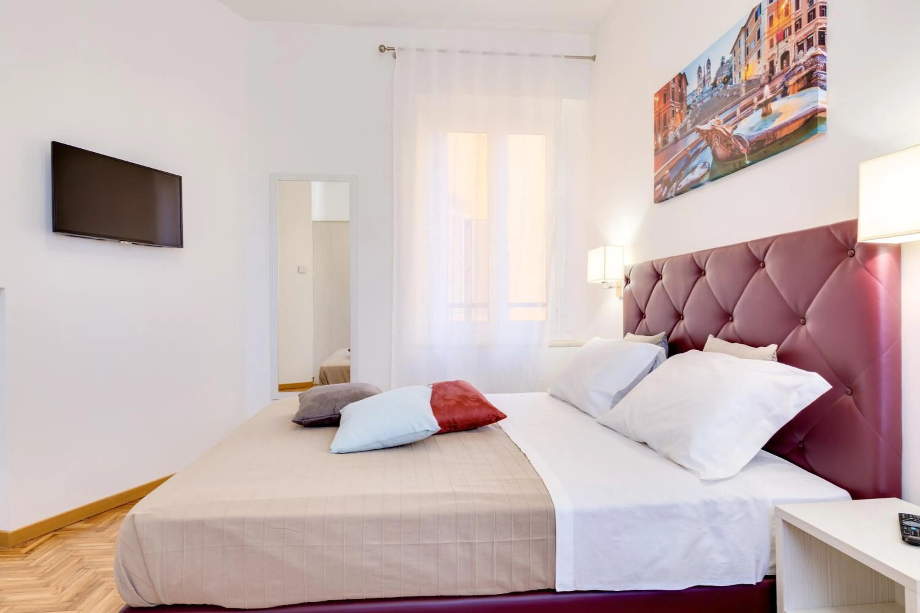 Bed in Dolce Luxury Rooms