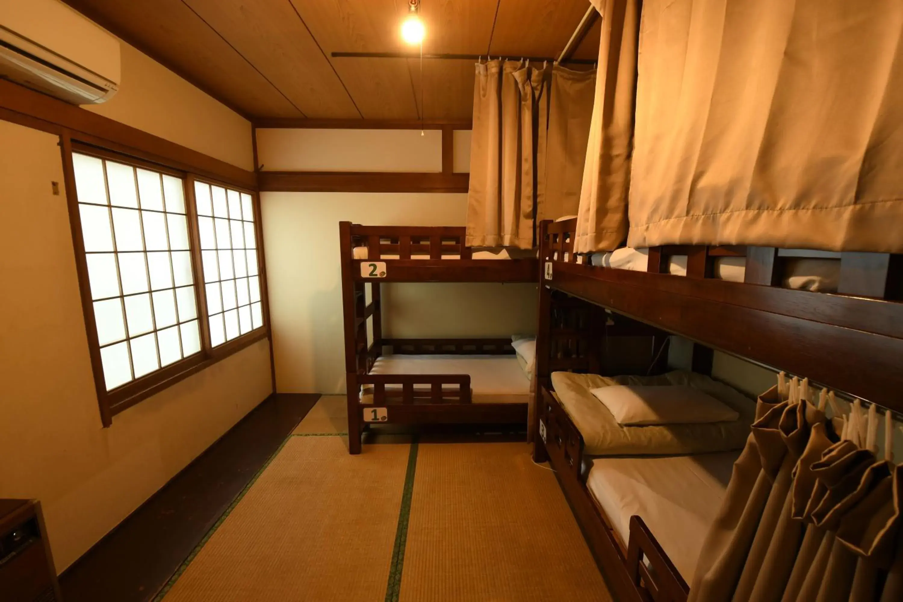 Bed in 4-Bed Mixed Dormitory Room in Onsenyado Hamayu Nagi Bed in 4-Bed Mixed Dormitory Room in Onsenyado Hamayu Nagi