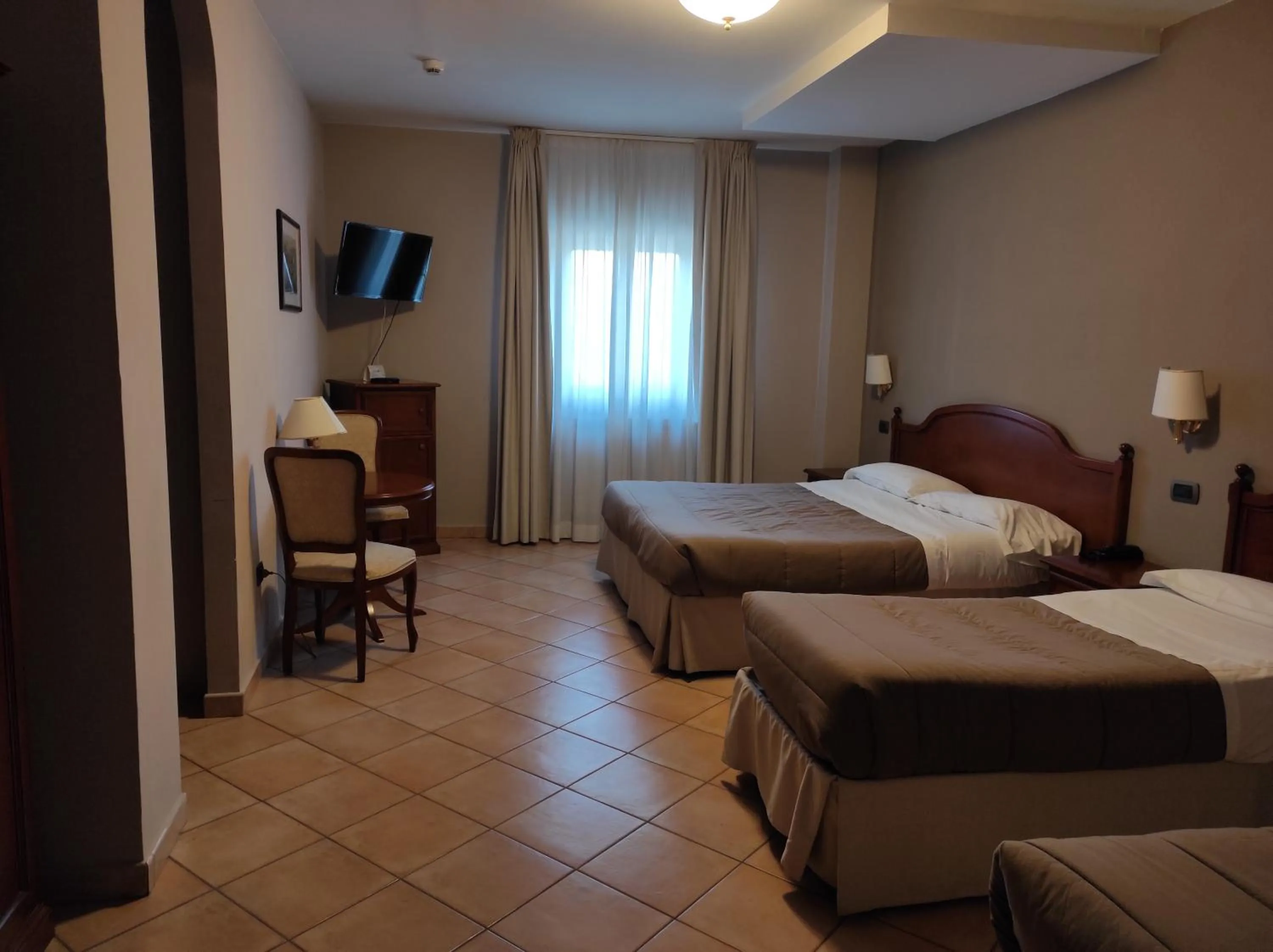 Bed in Hotel Le Mura