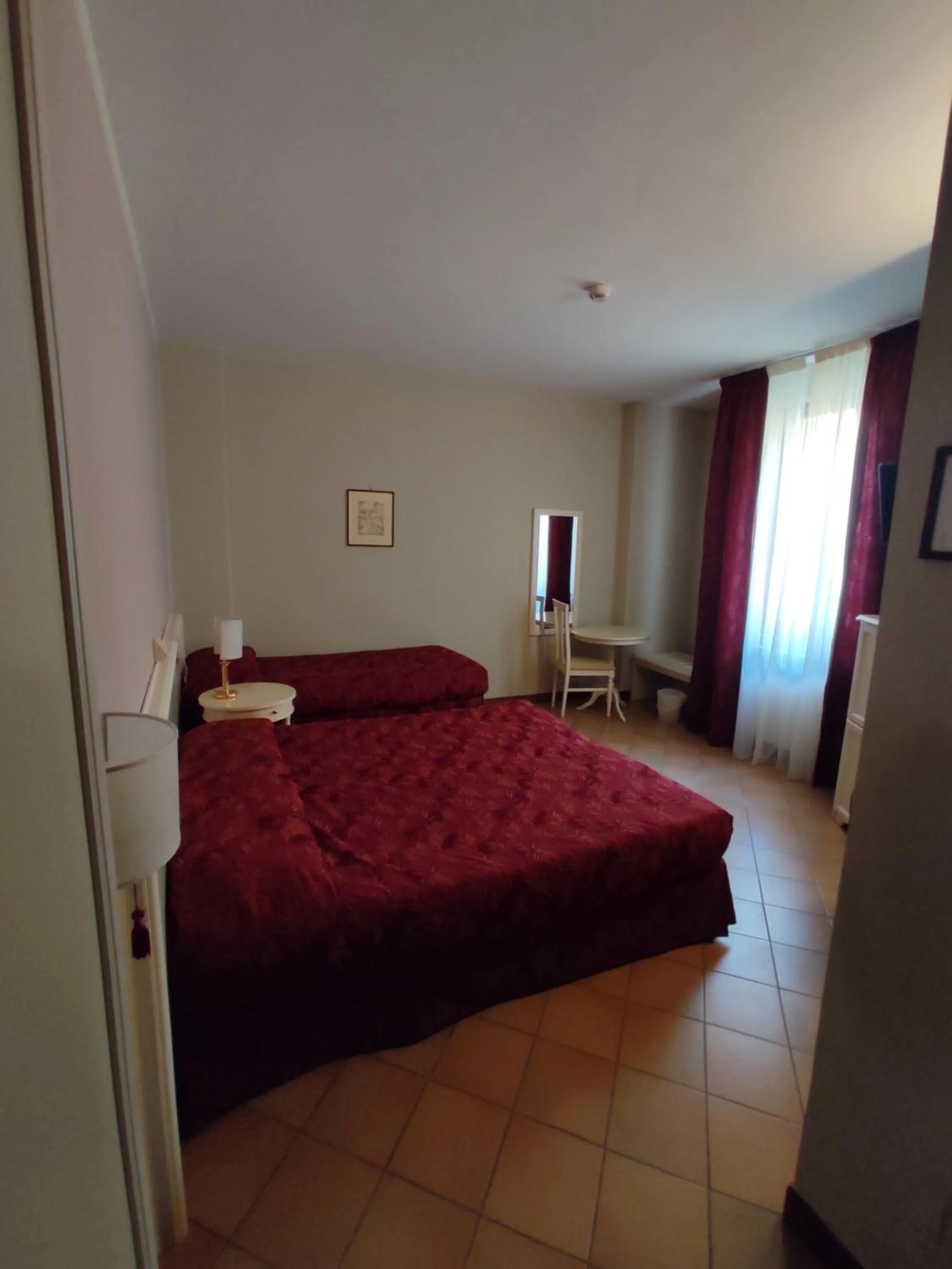 Bed in Hotel Le Mura