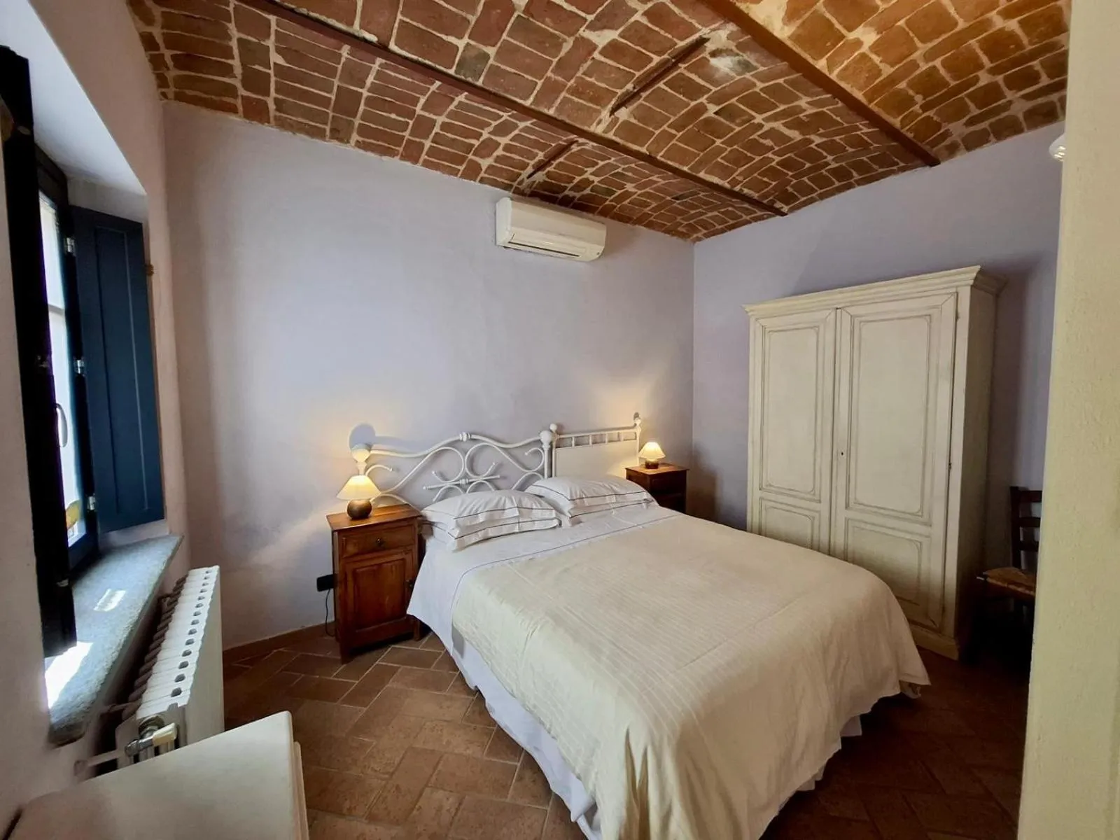 Bed in Le Serre Suites & Apartments