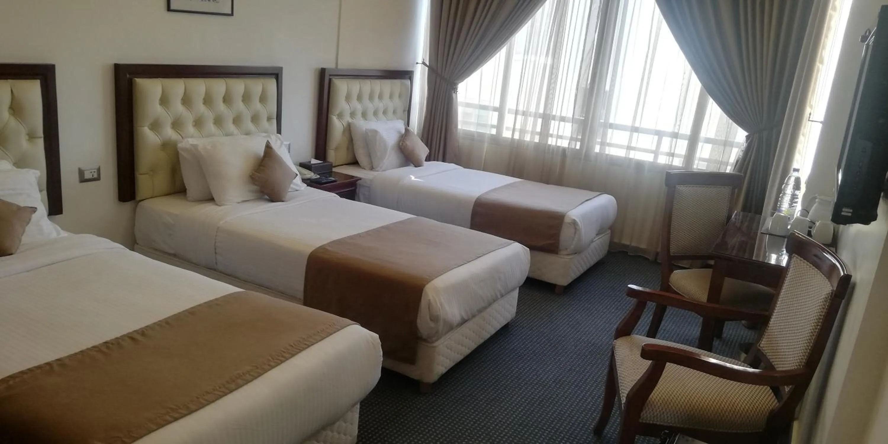 Bed in Midtown Hotel & Suites