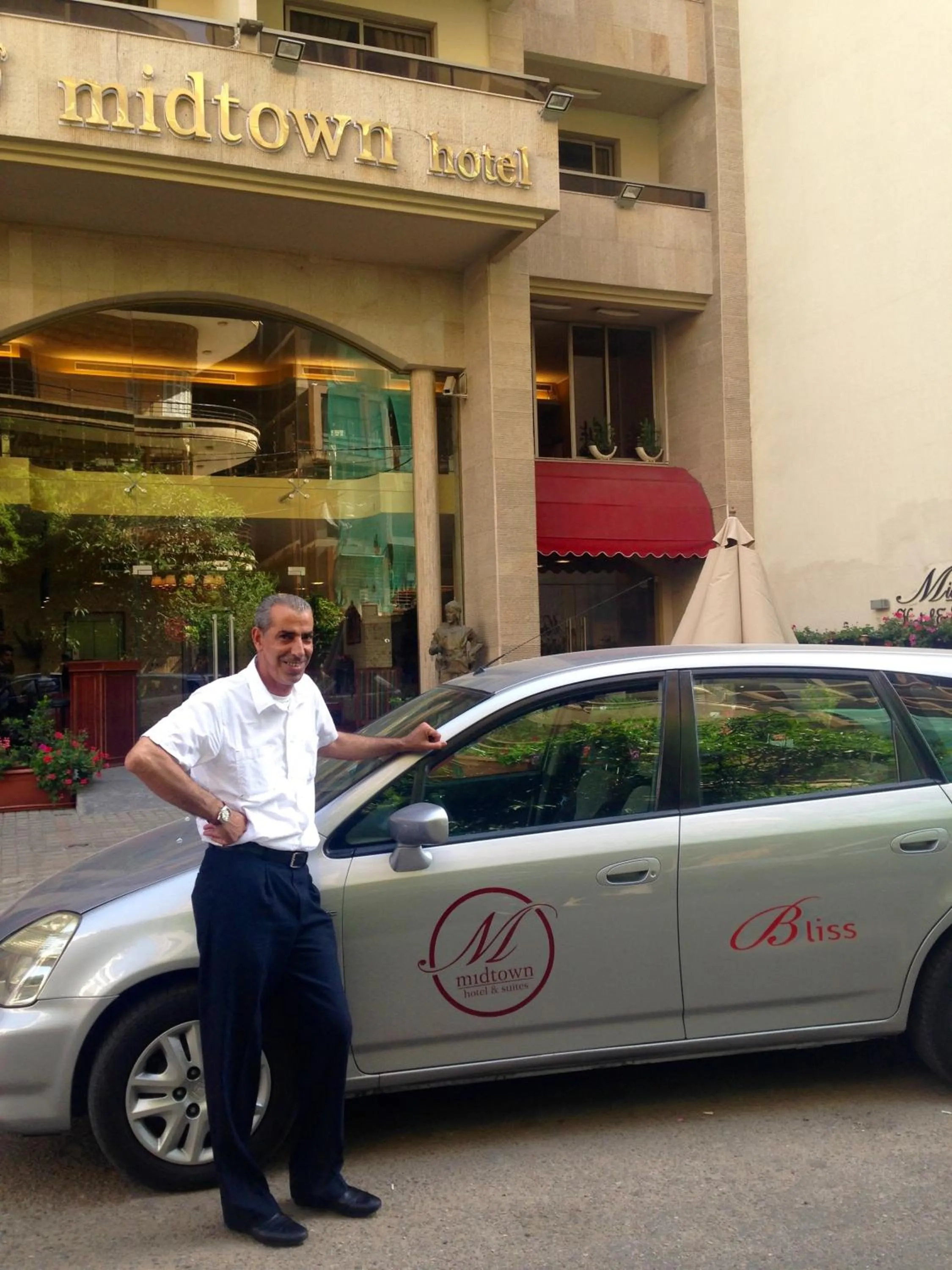 Property logo or sign in Midtown Hotel & Suites