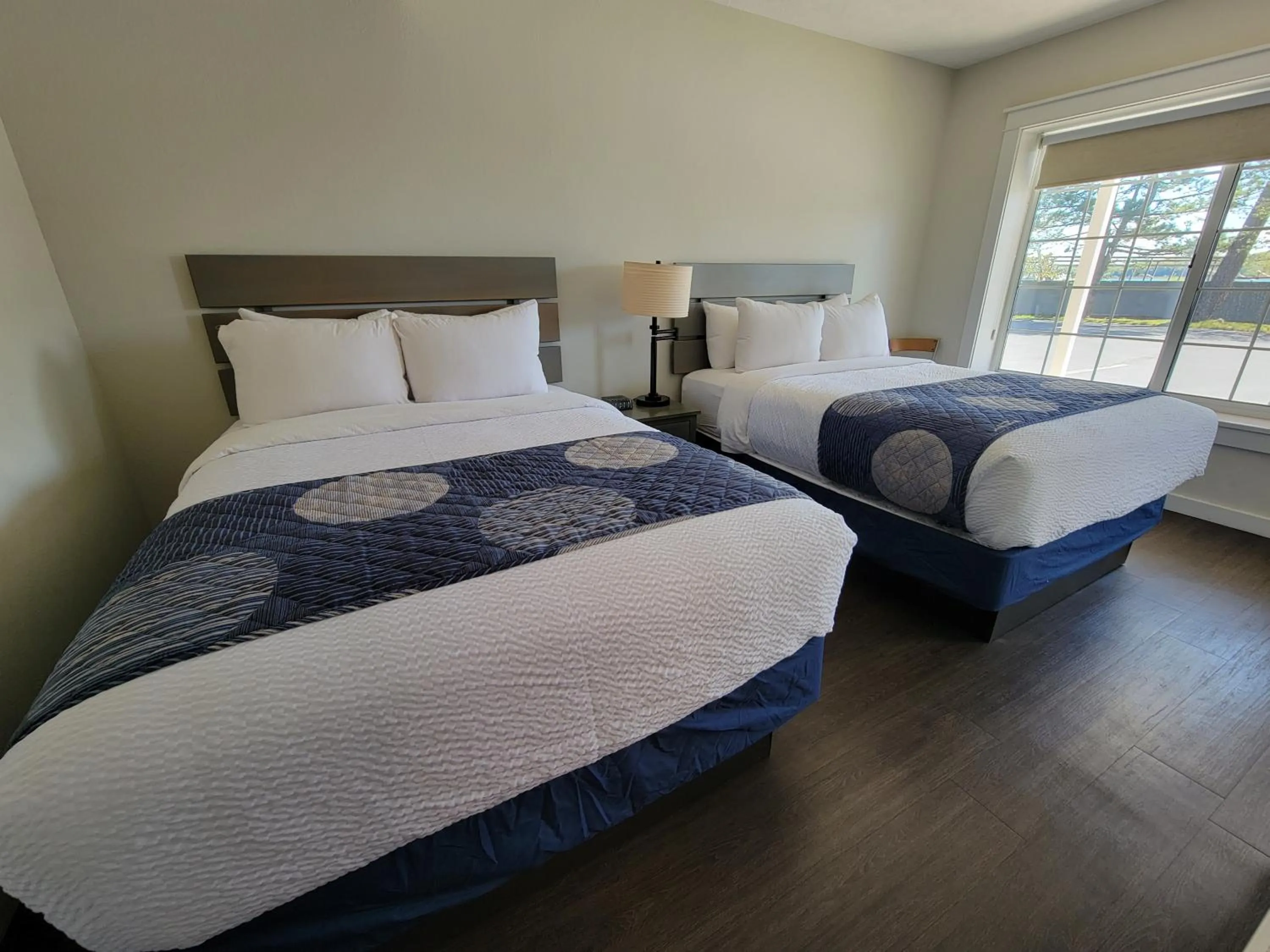 Bed in Brio Beach Inn