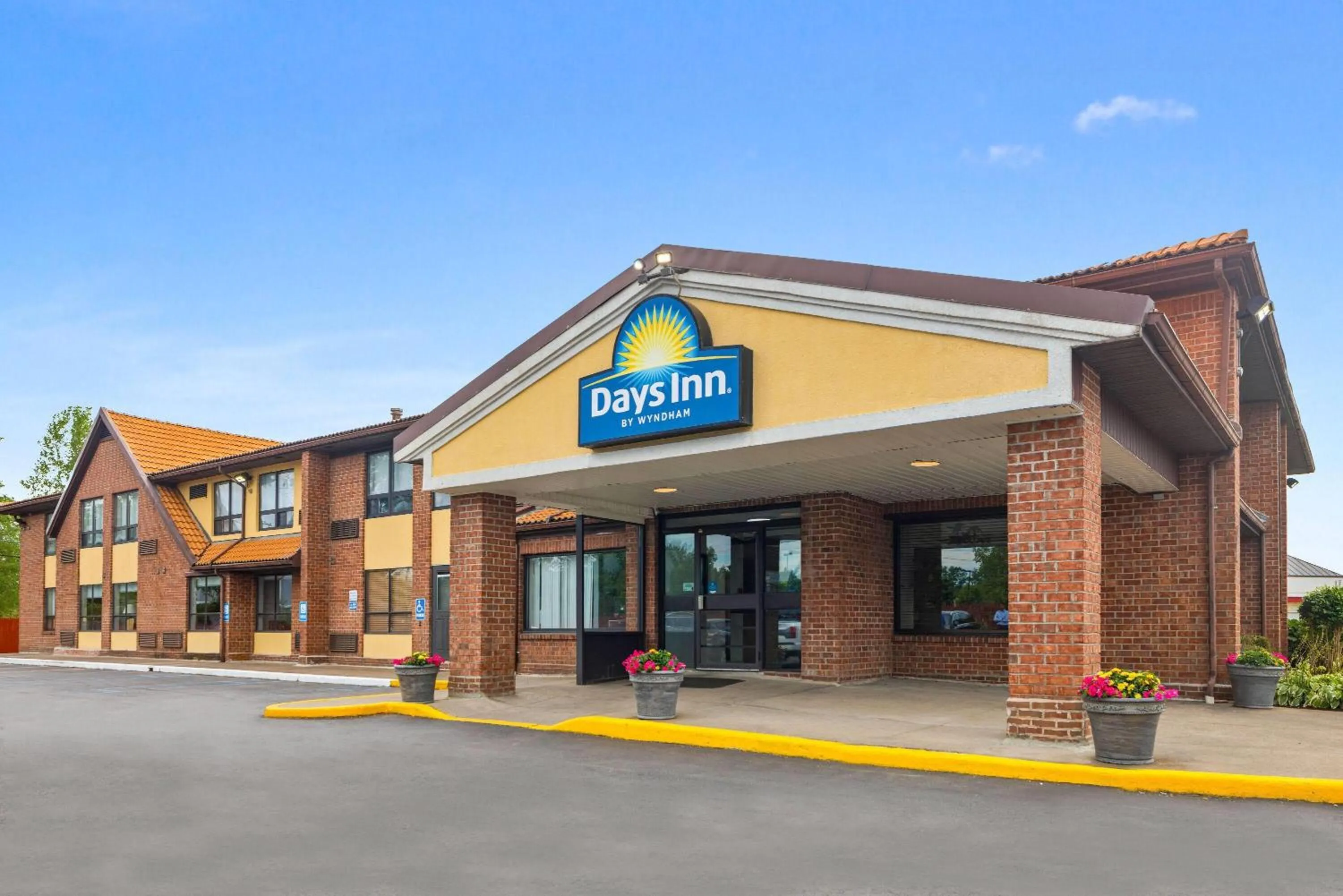 Property building in Days Inn by Wyndham Utica