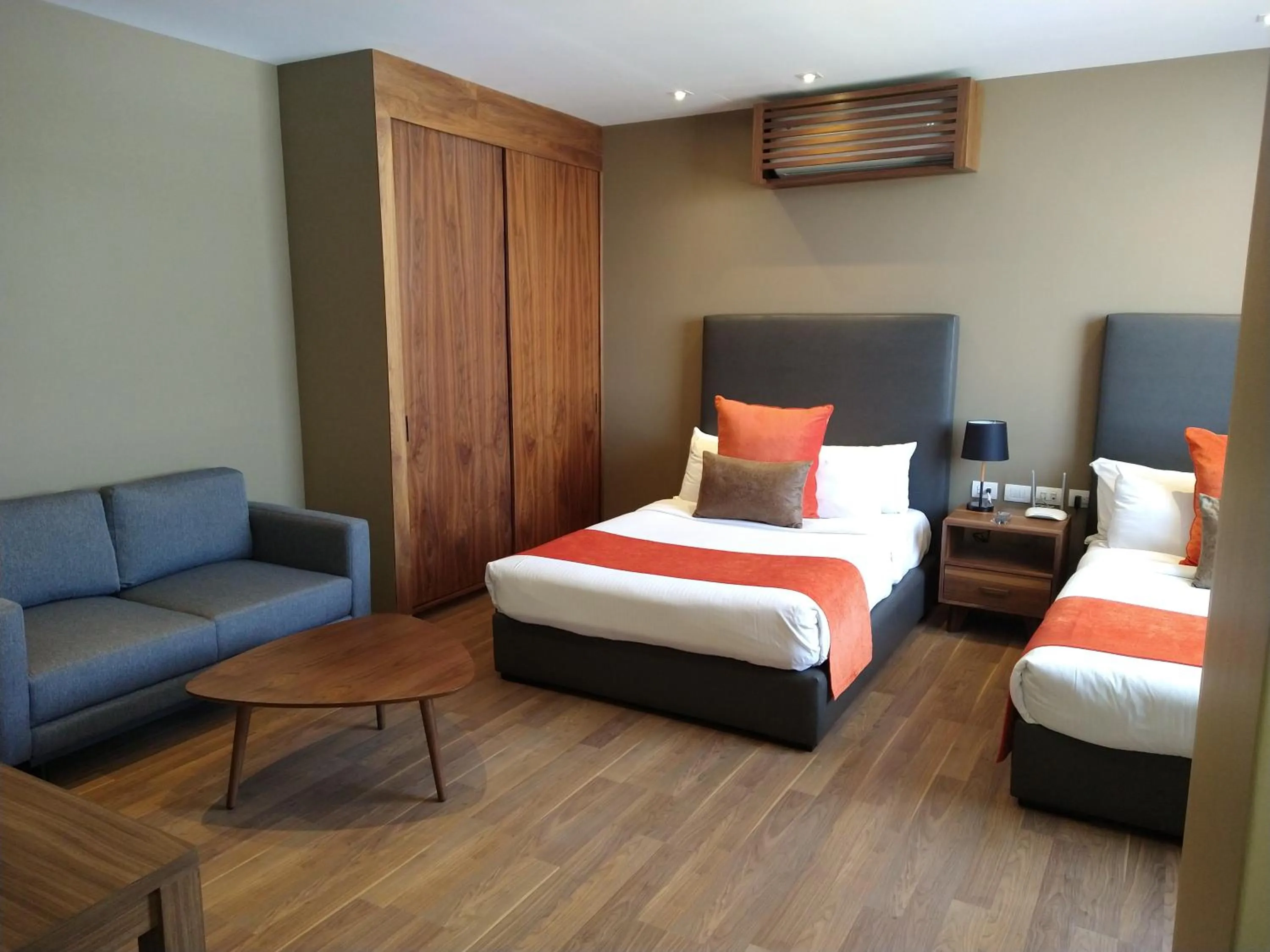 Living room, Bed in Hausuites