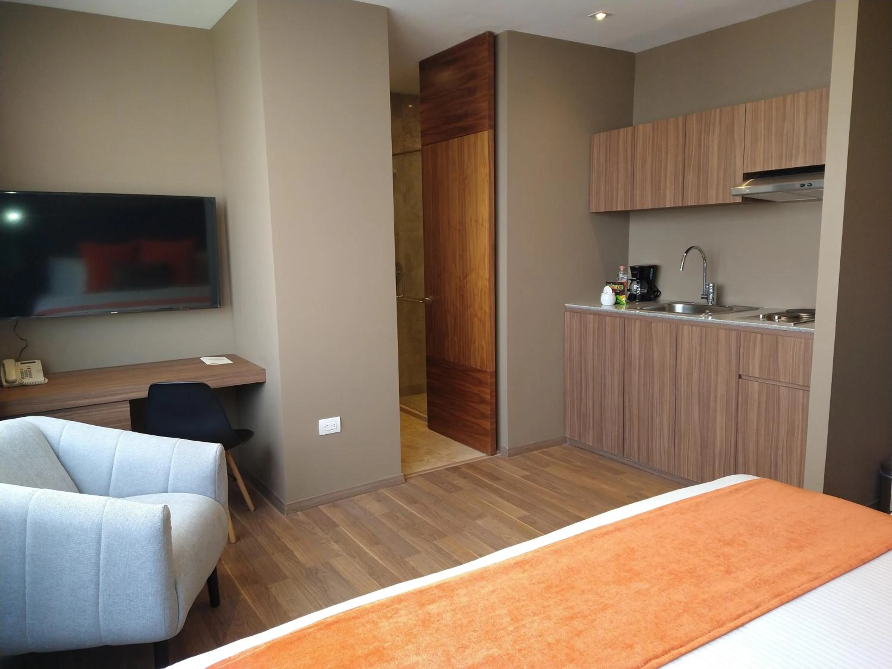 Kitchen or kitchenette, Bed in Hausuites