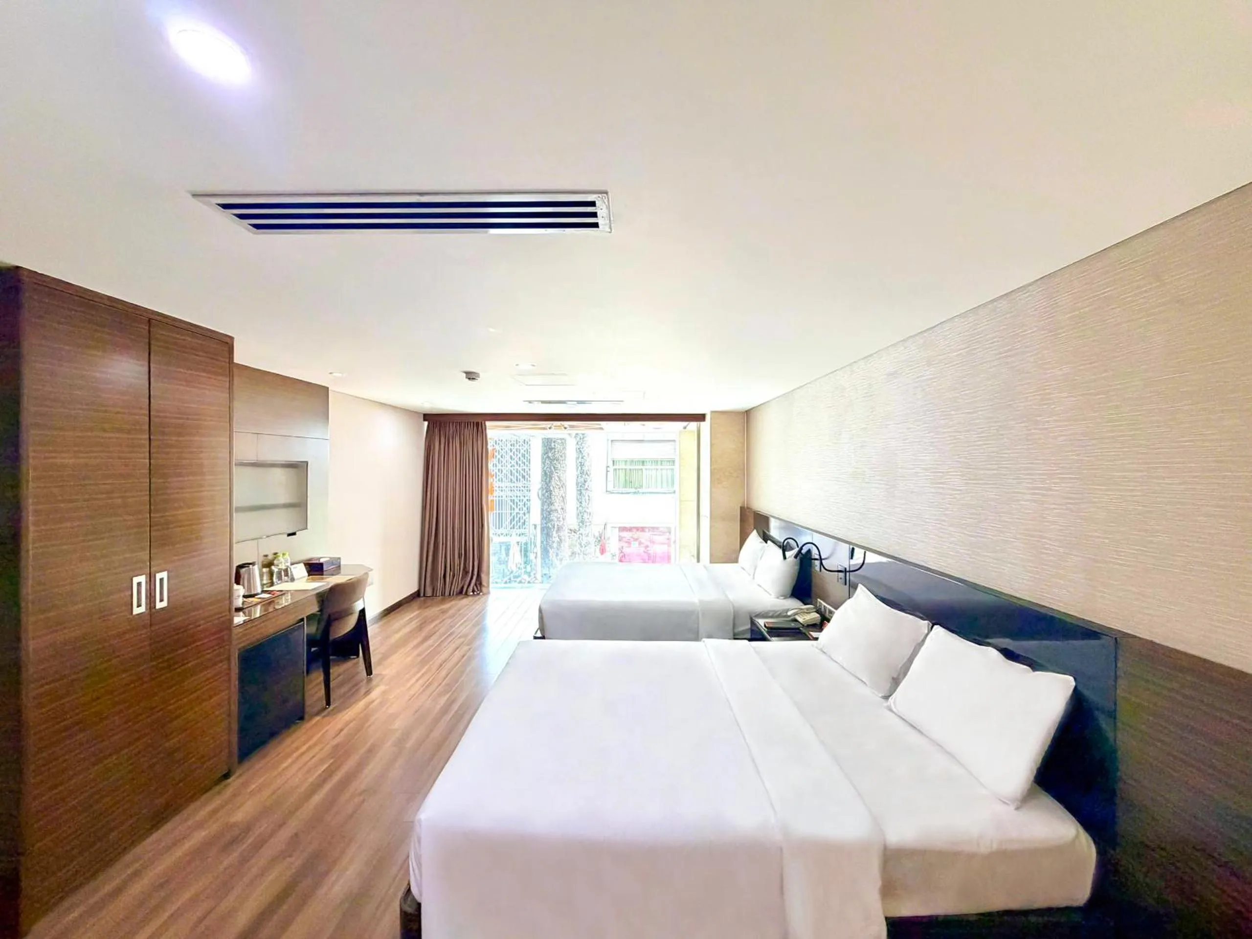 Bed in Queen Ann Hotel